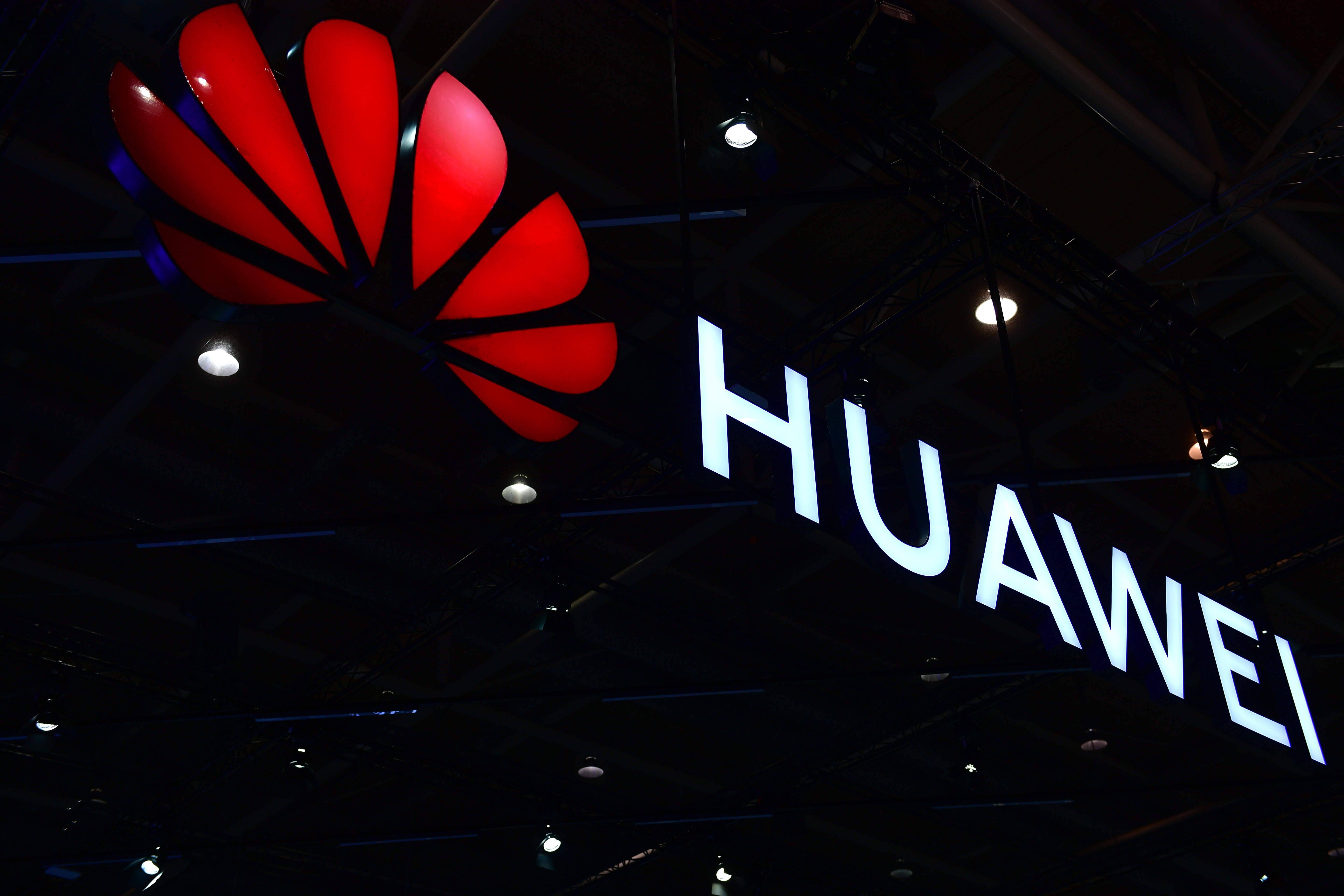 The Huawei logo is displayed at the 2018 CeBIT technology trade fair on June 12, 2018 in Hanover, Germany.