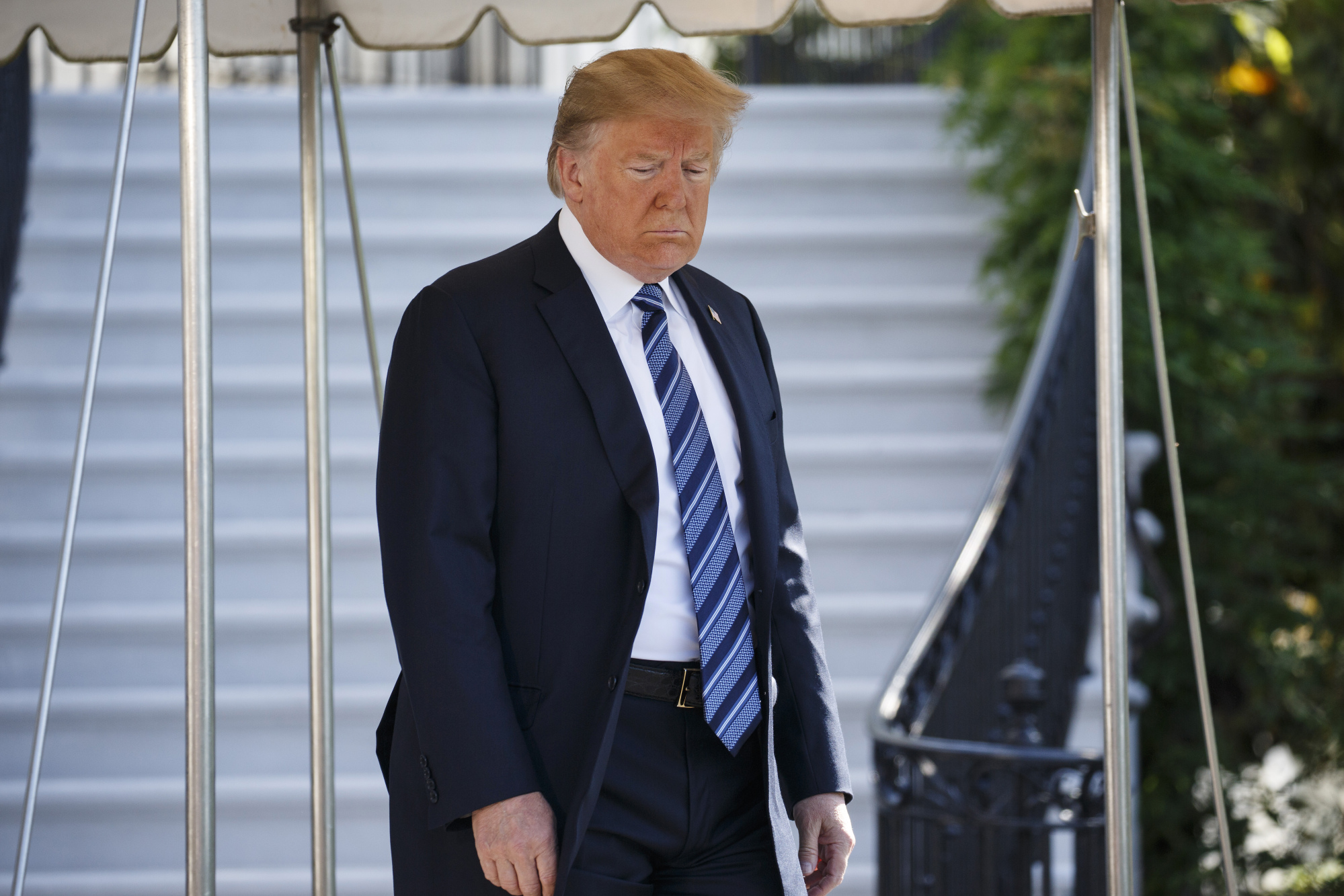 U.S. President Donald Trump exits the White House to board Marine One in Washington, D.C. Photographer: Joshua Roberts/Bloomberg
