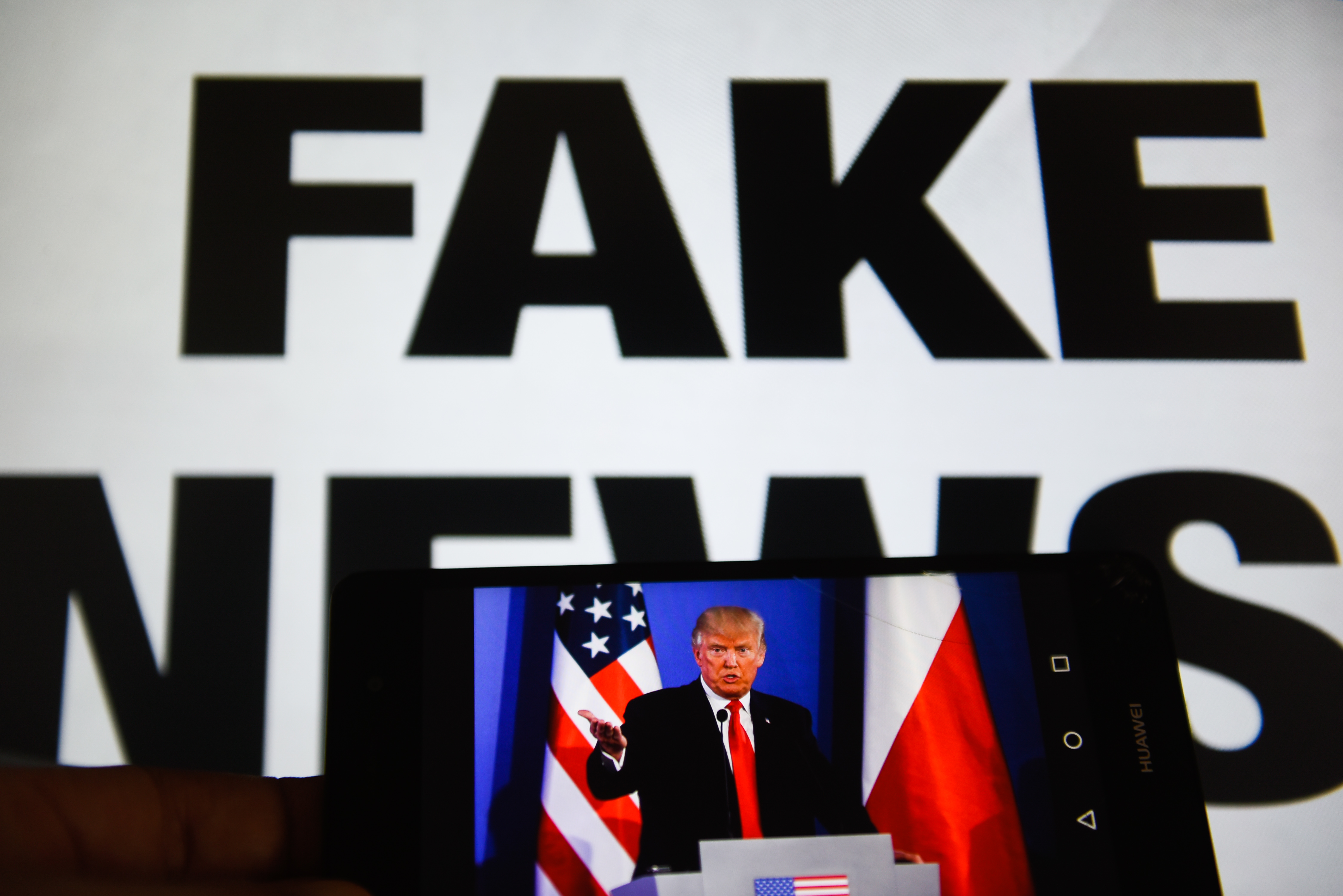A mobile phone shows President of United States of America,