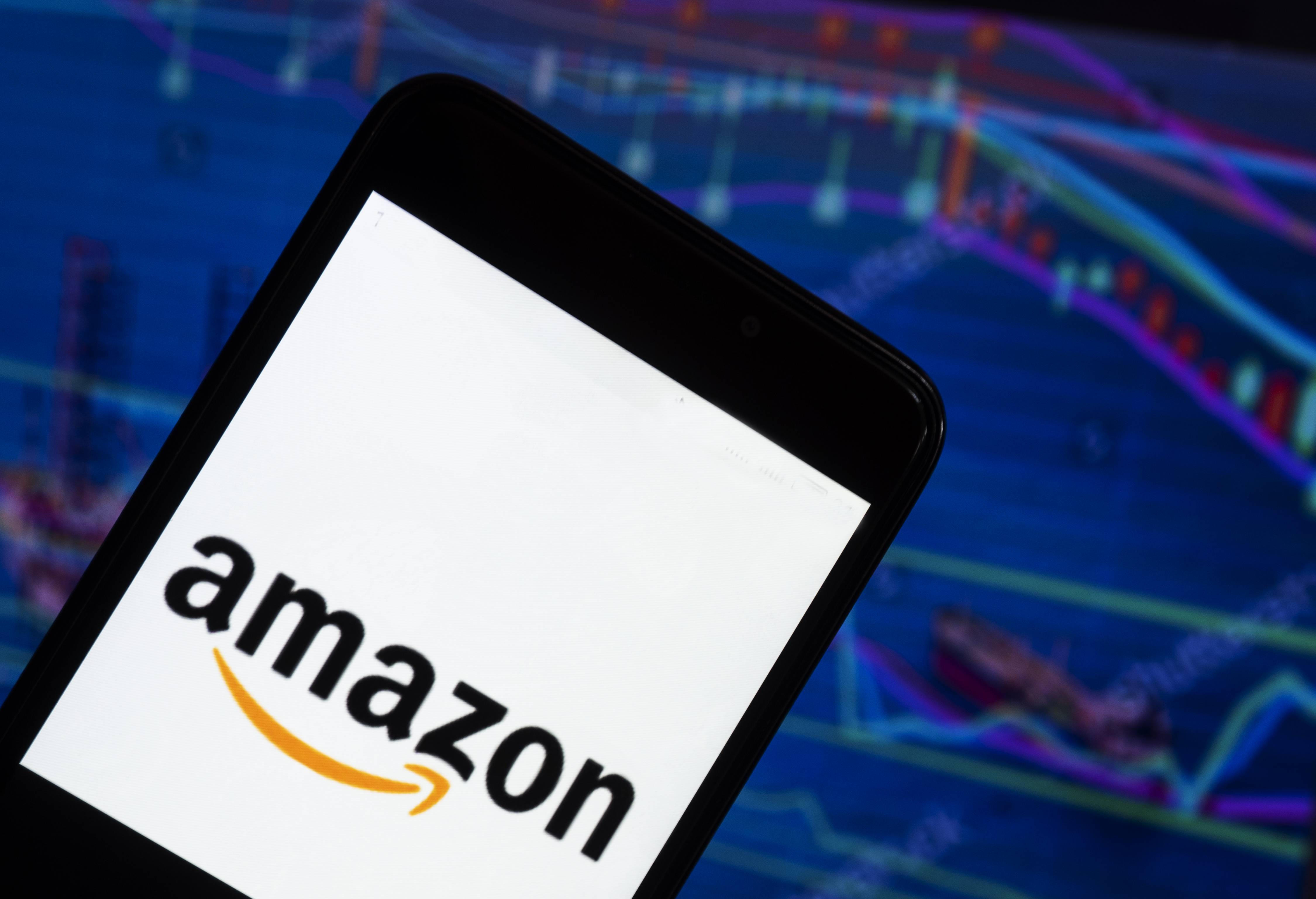 The Amazon logo seen displayed on a smart phone with a