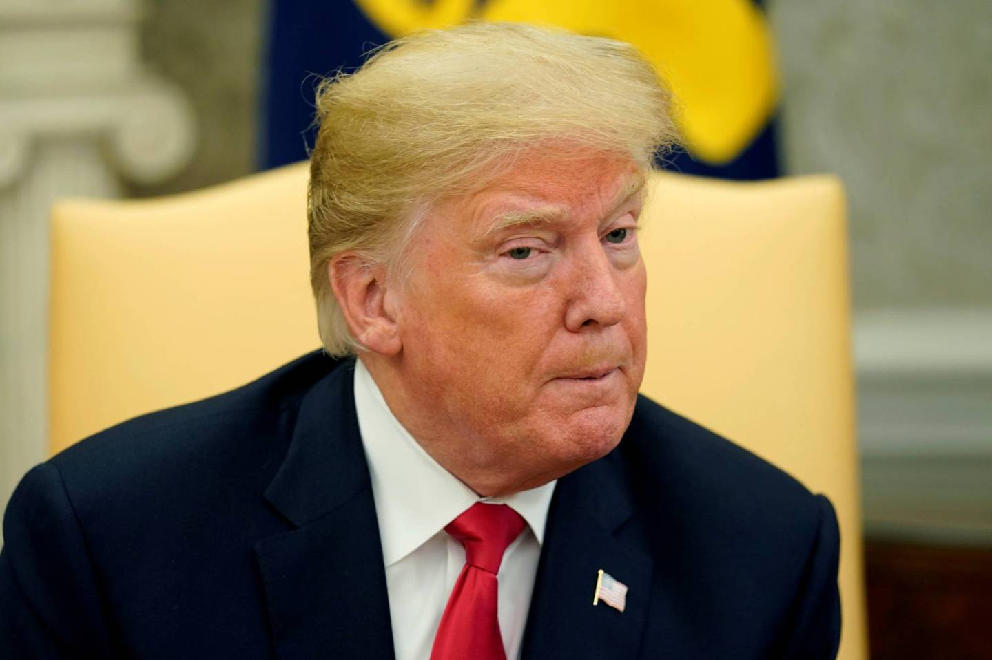 U.S. President Donald Trump answers a question about U.S. Supreme Court nominee Brett Kavanaugh during a meeting with Chilean President Sebastian Pinera in the Oval Office of the White House in Washington