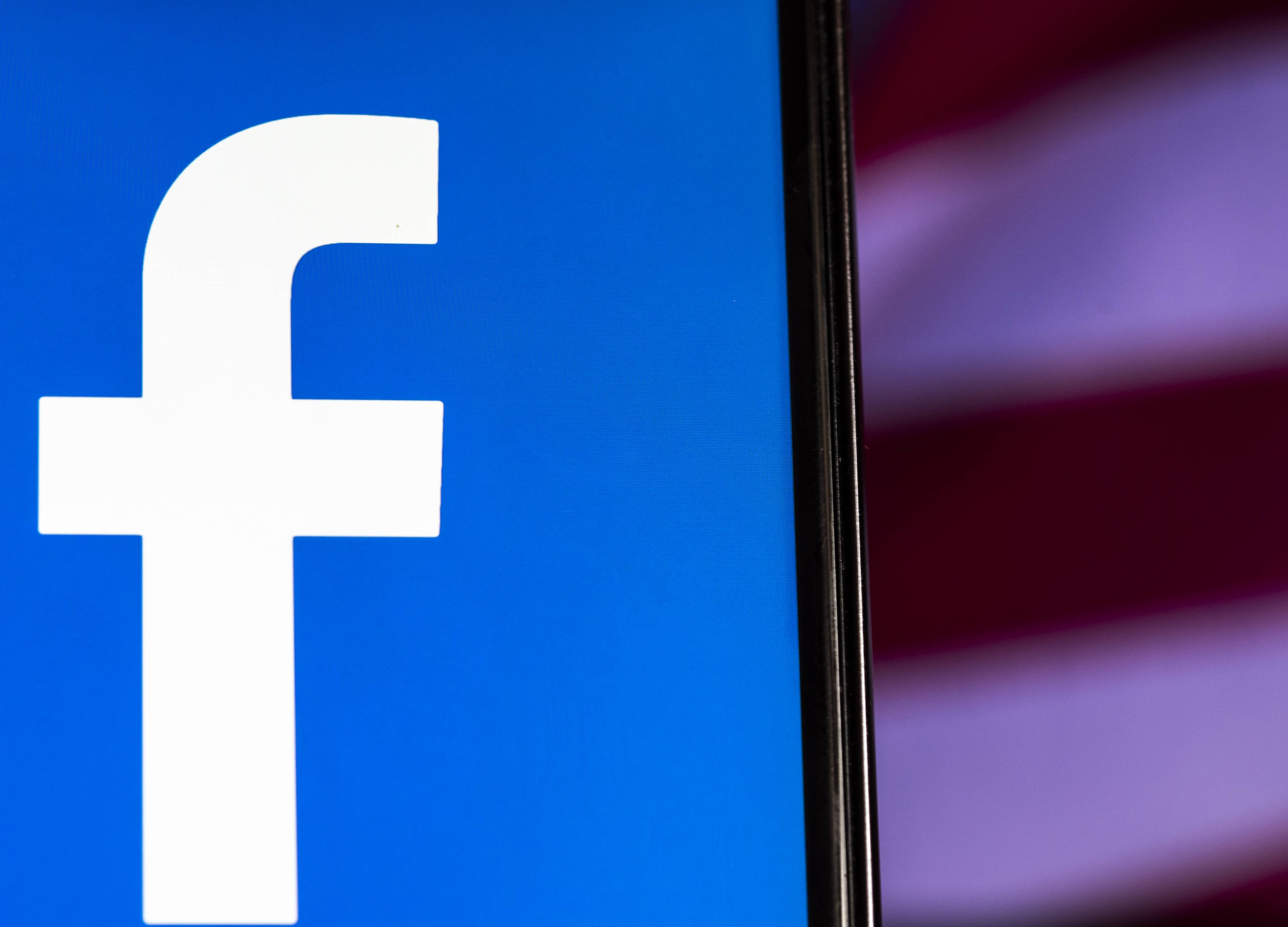Facebook logo seen displayed on smart phone