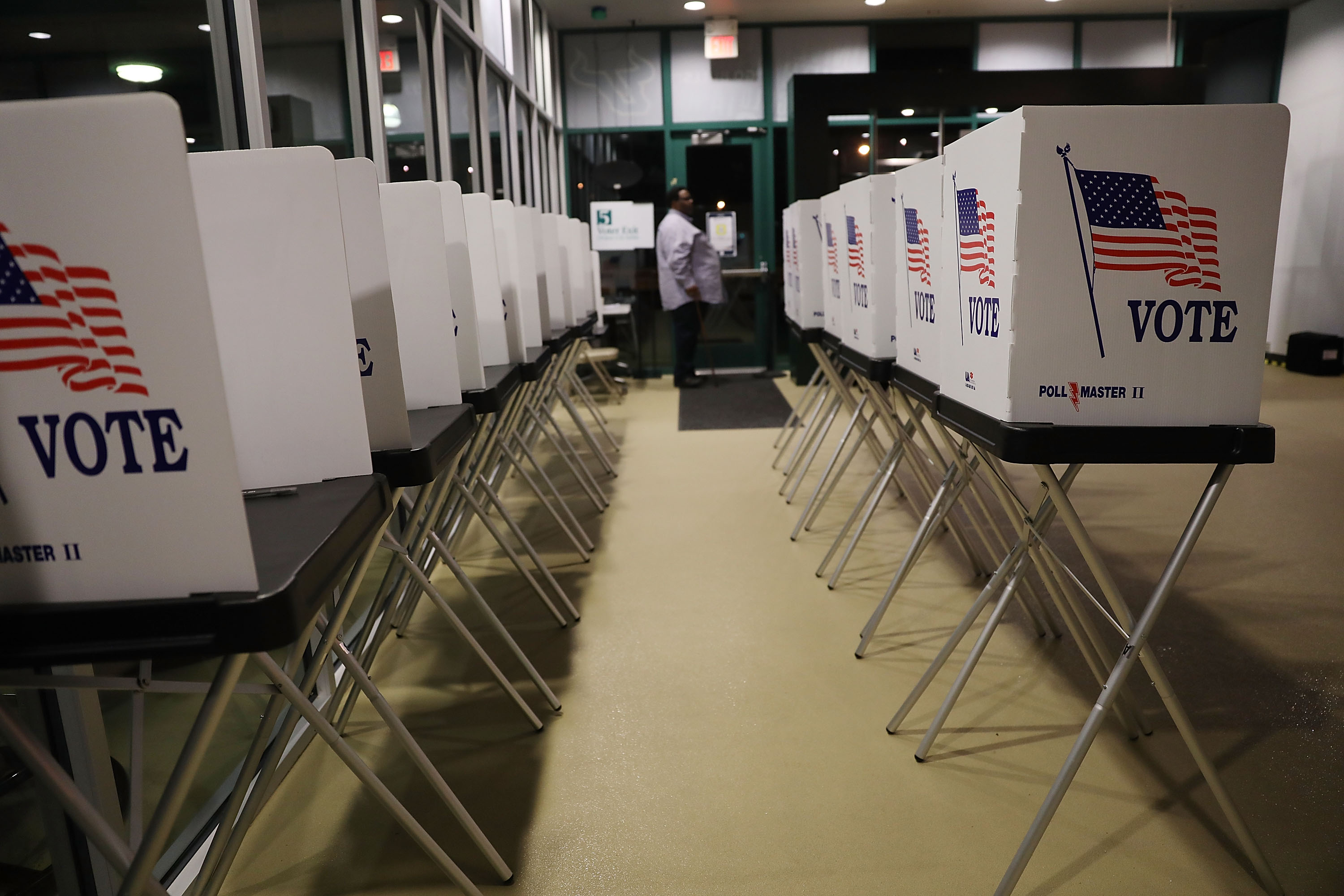 Voting booths are setup at the Yuengling center on the campus of University of South Florida as workers prepare to open the doors to early voters on October 22, 2018 in Tampa, Florida. Florida voters head to the polls to cast their early ballots in the race for the Senate as well as the Governors seats.