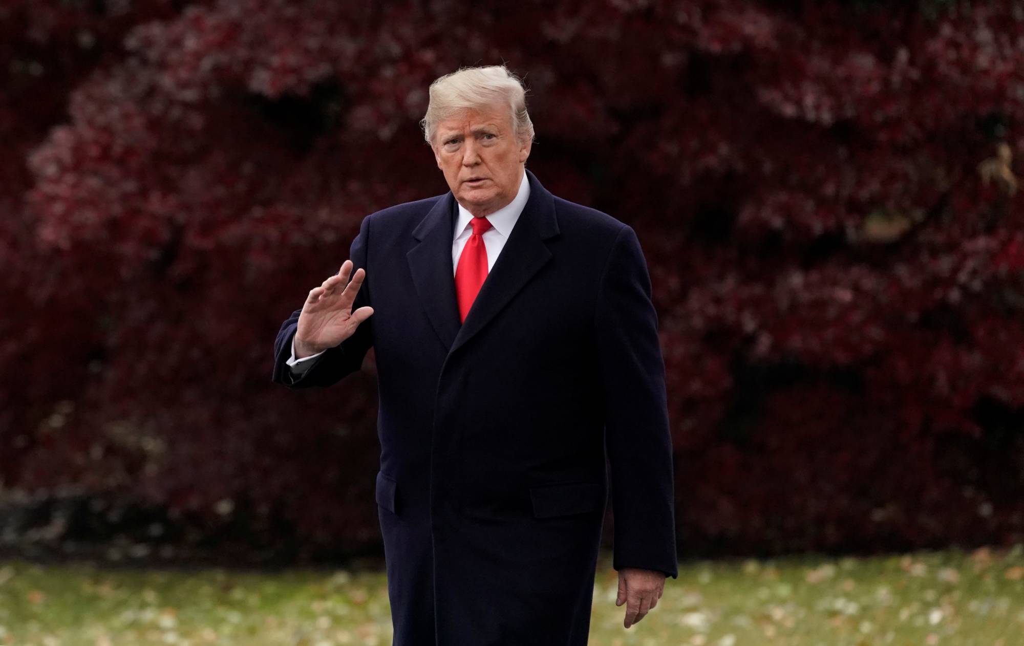 U.S. President Trump walks to board the Marine One helicopter to begin his travel to Mississippi from the White House in Washington