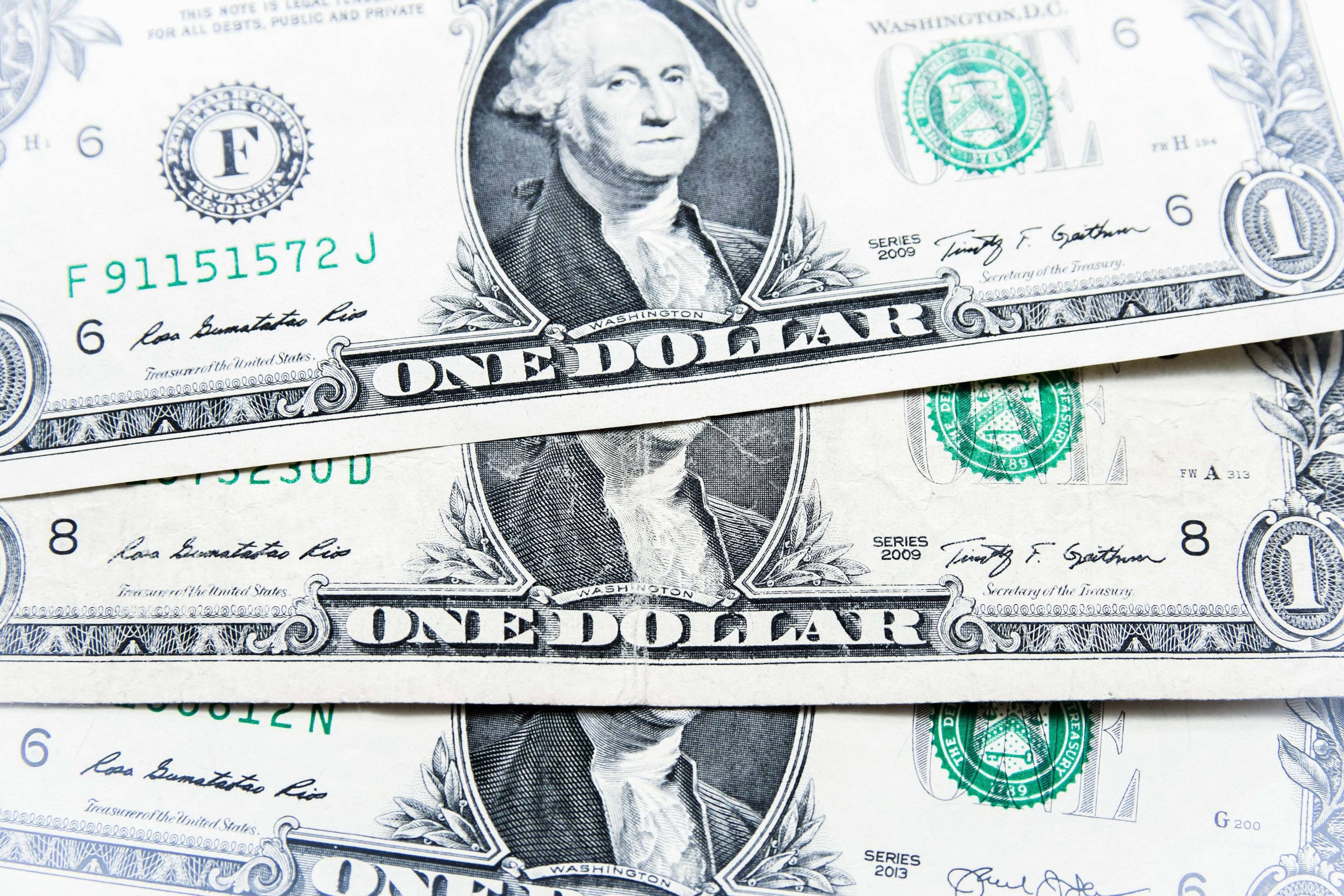 One (1) dollar bills seen displayed