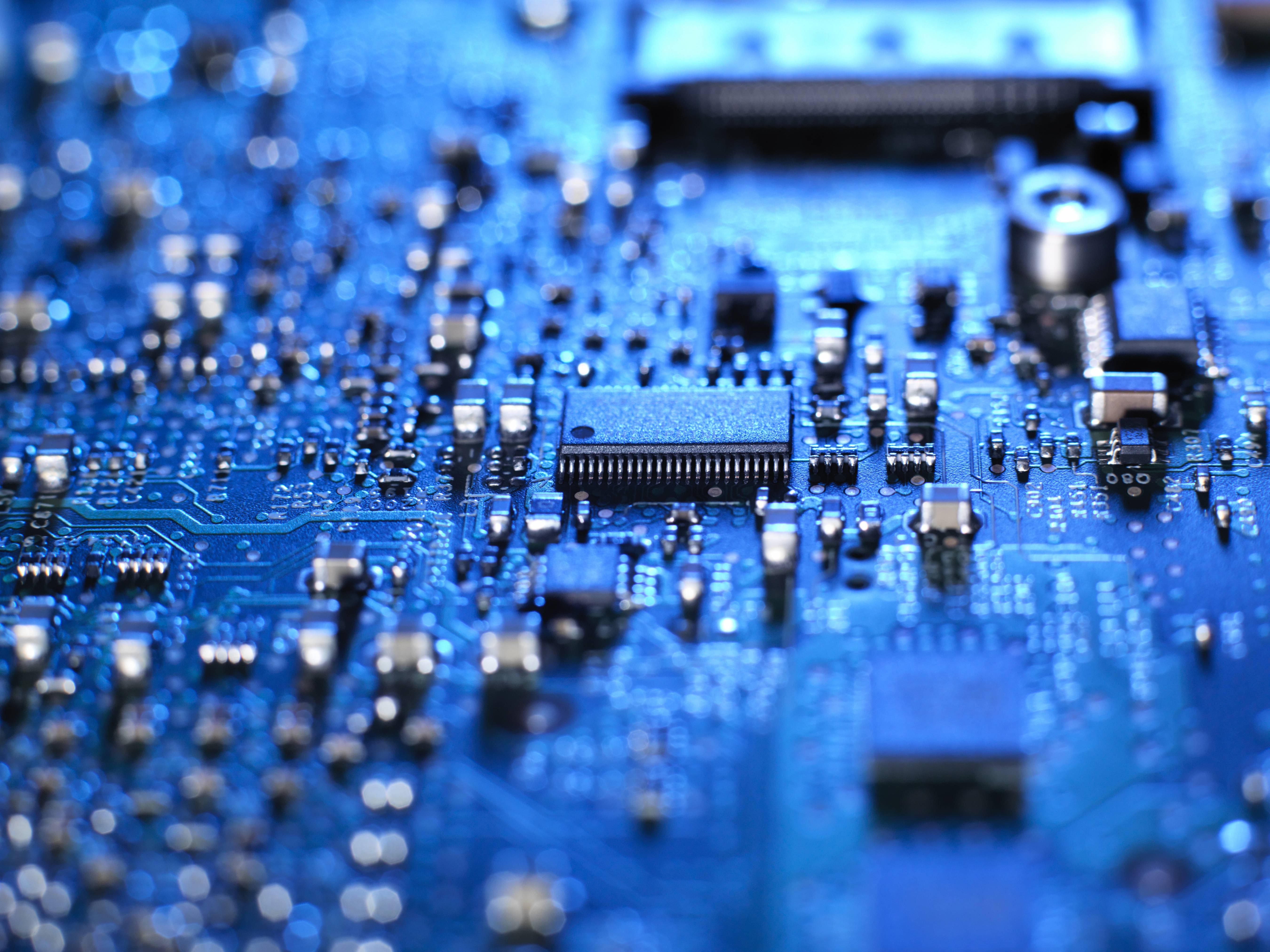 Inside of a laptop computer showing chips, circuit boards and components