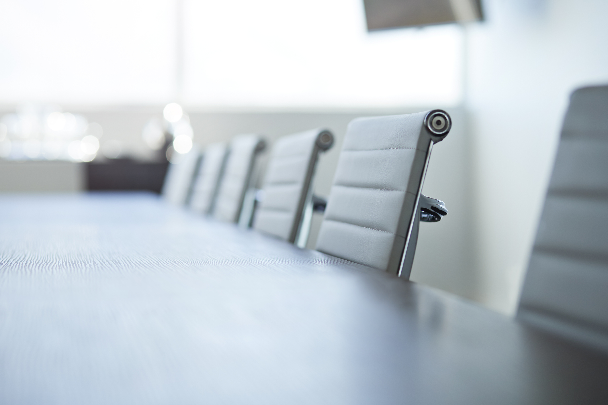 Row of empty chairs in board room