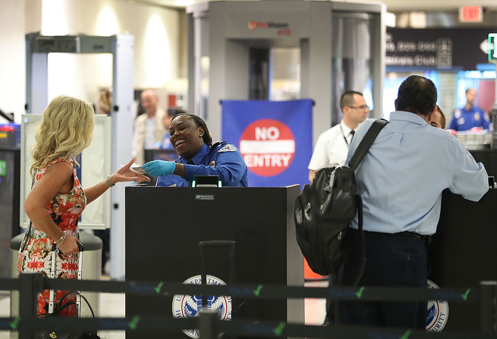 Transportation Security Administration Officials Demonstrates Time Saving Travel Tips At Miami Airport