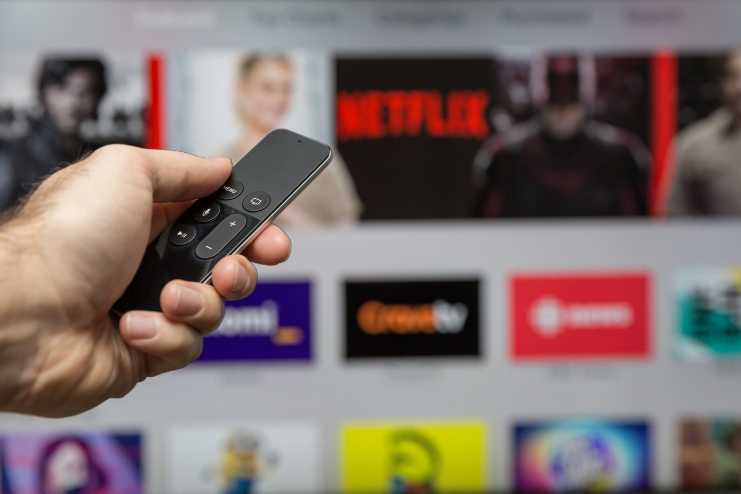 Human Hand Holding The New Apple Tv Siri Remote