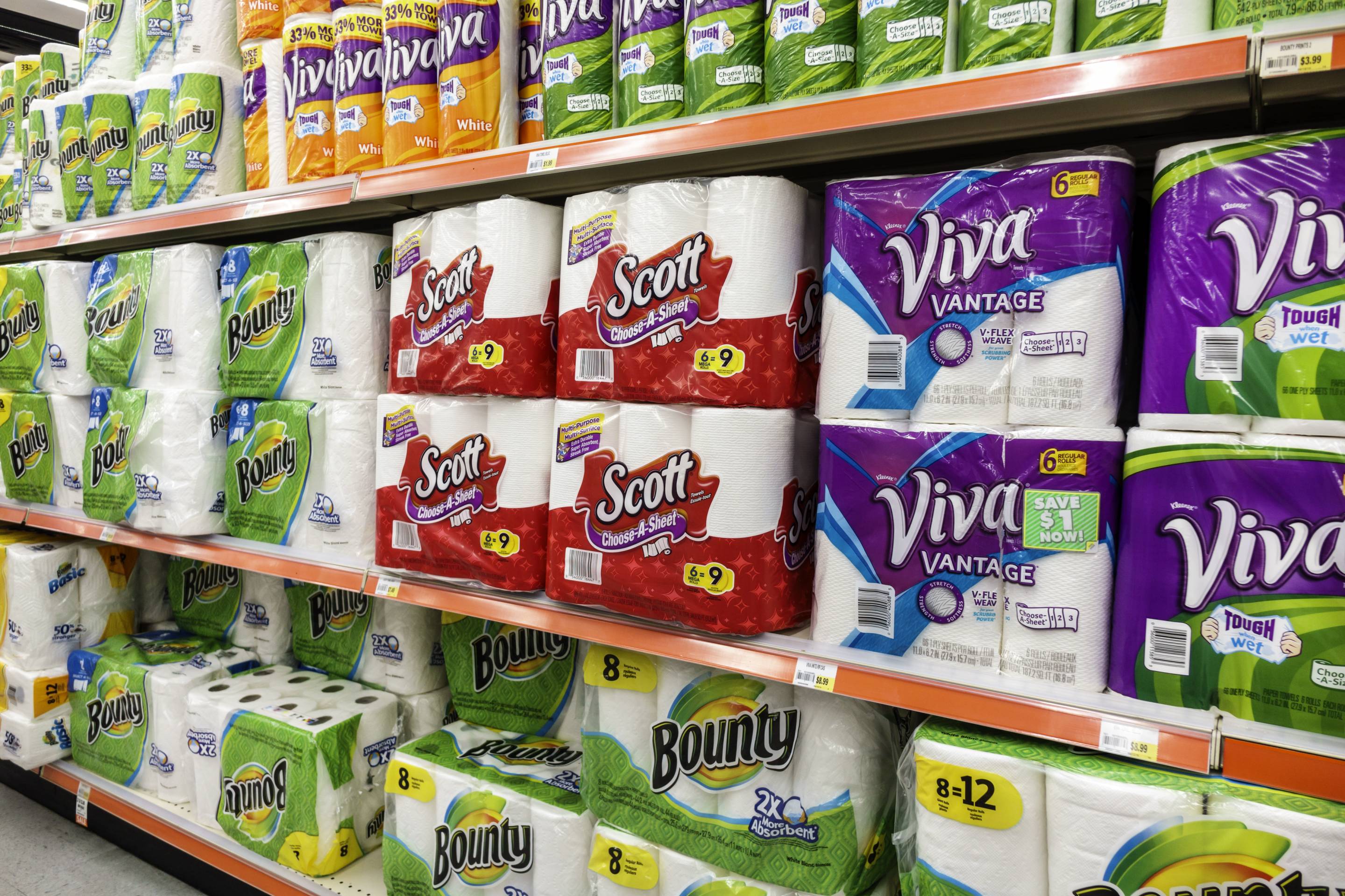 Shelves of paper towels for sale inside Navarro Discount Pharmacy.