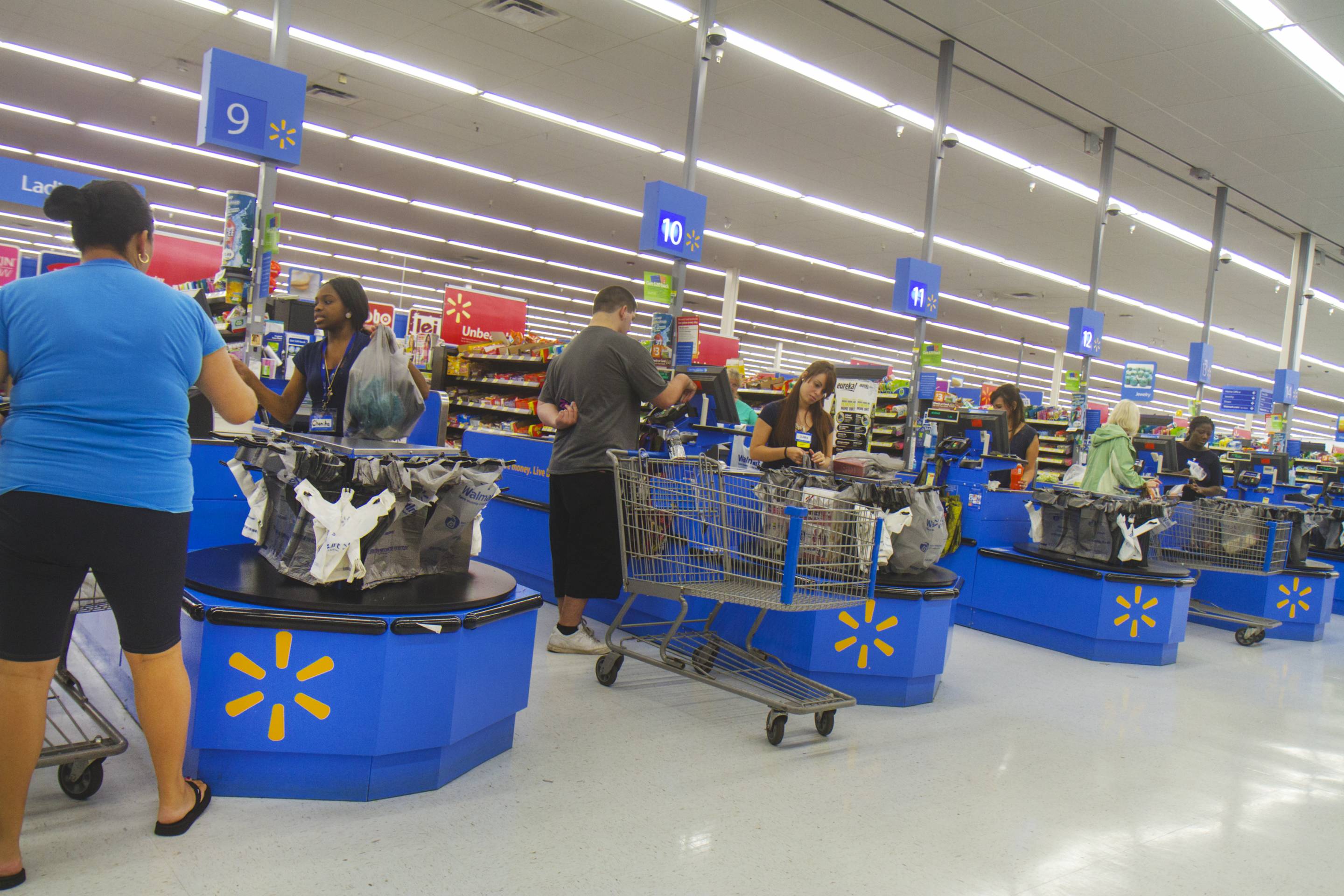The check out inside Walmart. (Photo by: Jeffrey Greenberg/UIG via Getty Images)