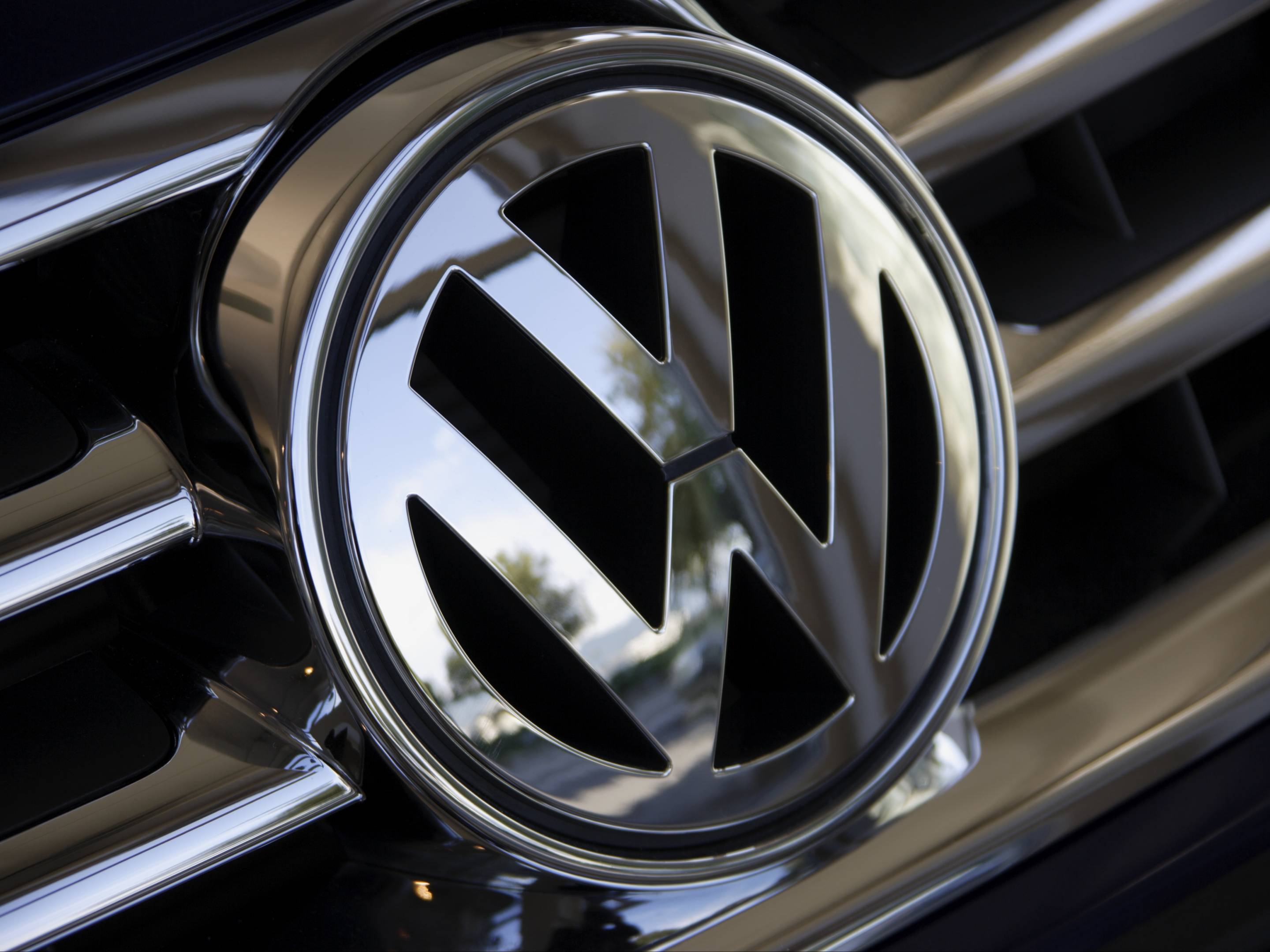 Close up of Volkswagen logo on car grill