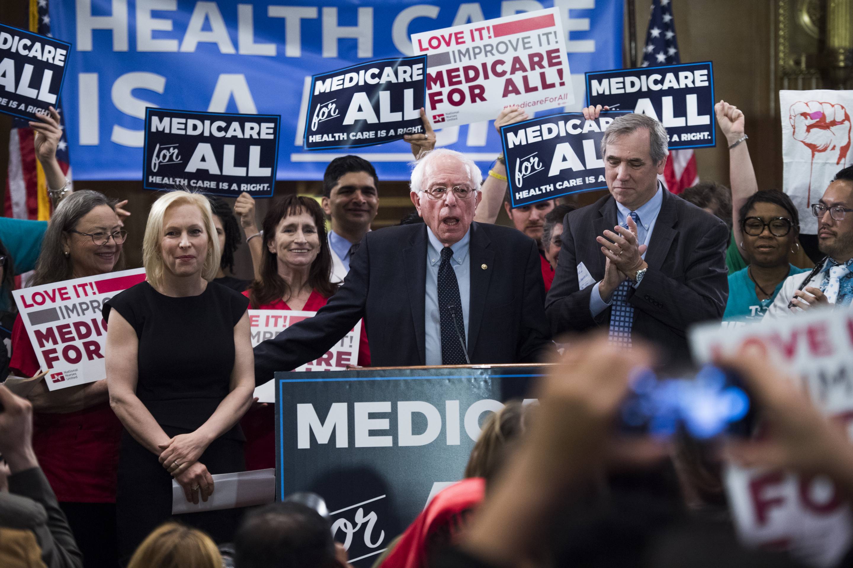 From left, Senators Kirsten Gillibrand (D-N.Y.), Bernie Sanders (I-Vt.), and Jeff Merkley (D-Ore.), introduce the "Medicare for All Act of 2019" on Apr. 10.