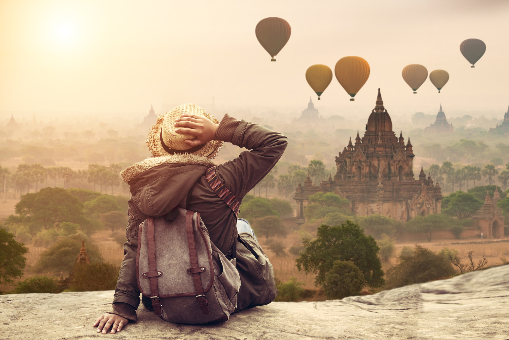 Myanmar, Young hipster woman traveller backpacker sitting watch Beautiful landscape Bagan Mandalay ancient pagoda in Bagan, Mandalay Myanmar.