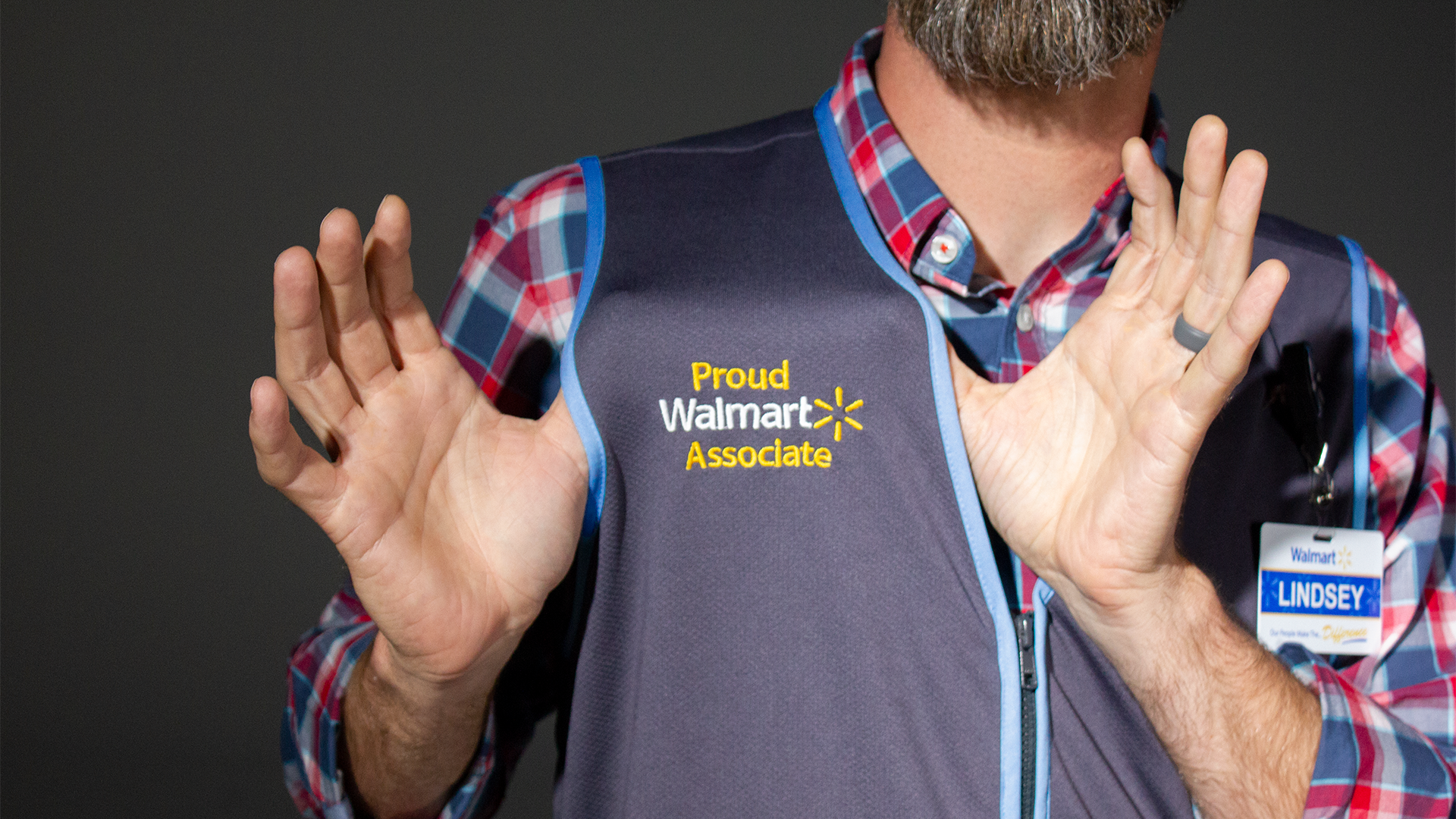 Walmart is redesigning its signature blue vests worn by employees in stores. In its place, Walmart says, will be steel gray vests weaved from a fabric made of recycled bottles with trims in colors that pop, including green, blue, hot pink and orange.