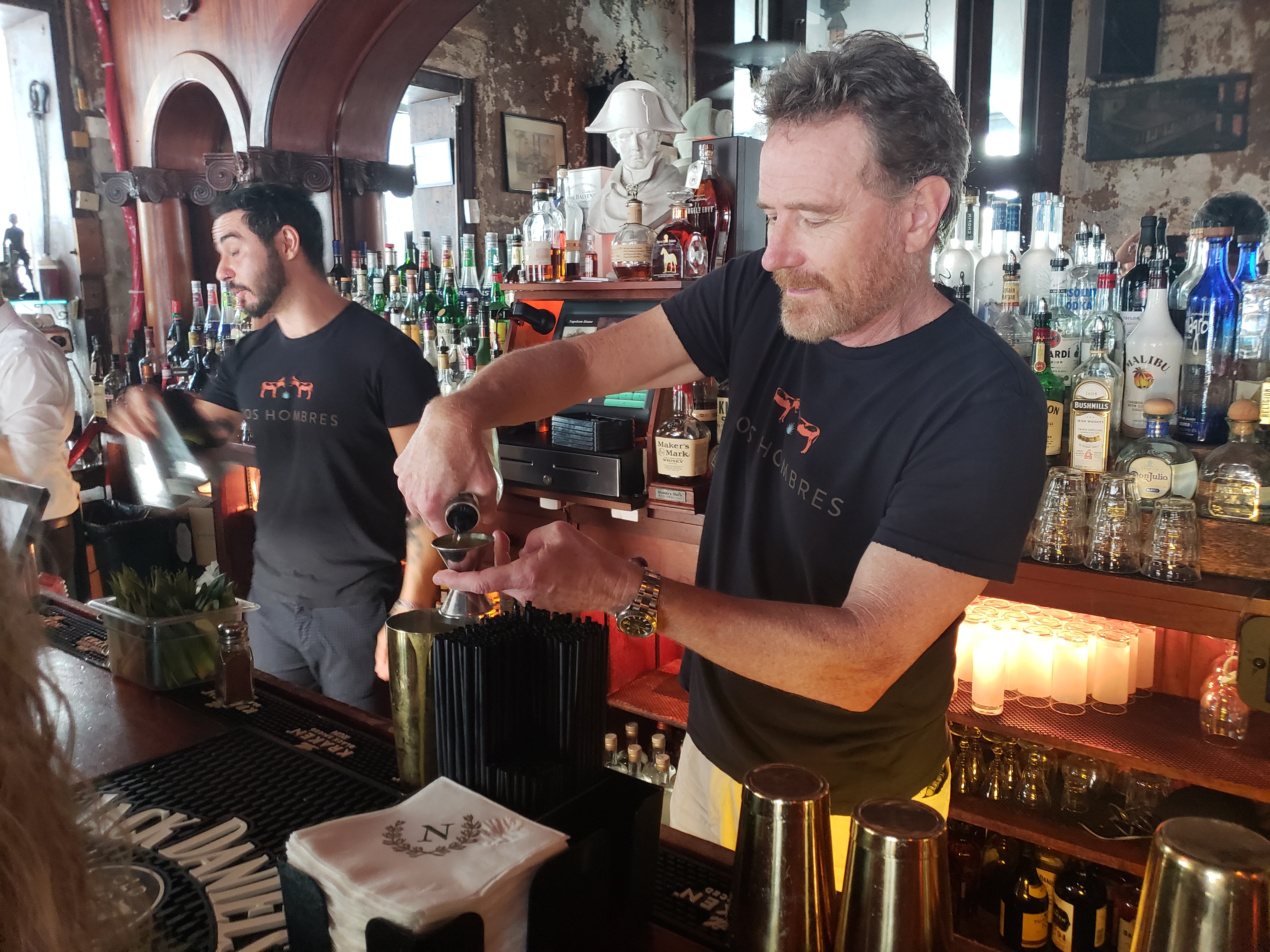 "Breaking Bad" actor Bryan Cranston pouring drinks made with their new mezcal brand, Dos Hombres, in New Orleans last week.