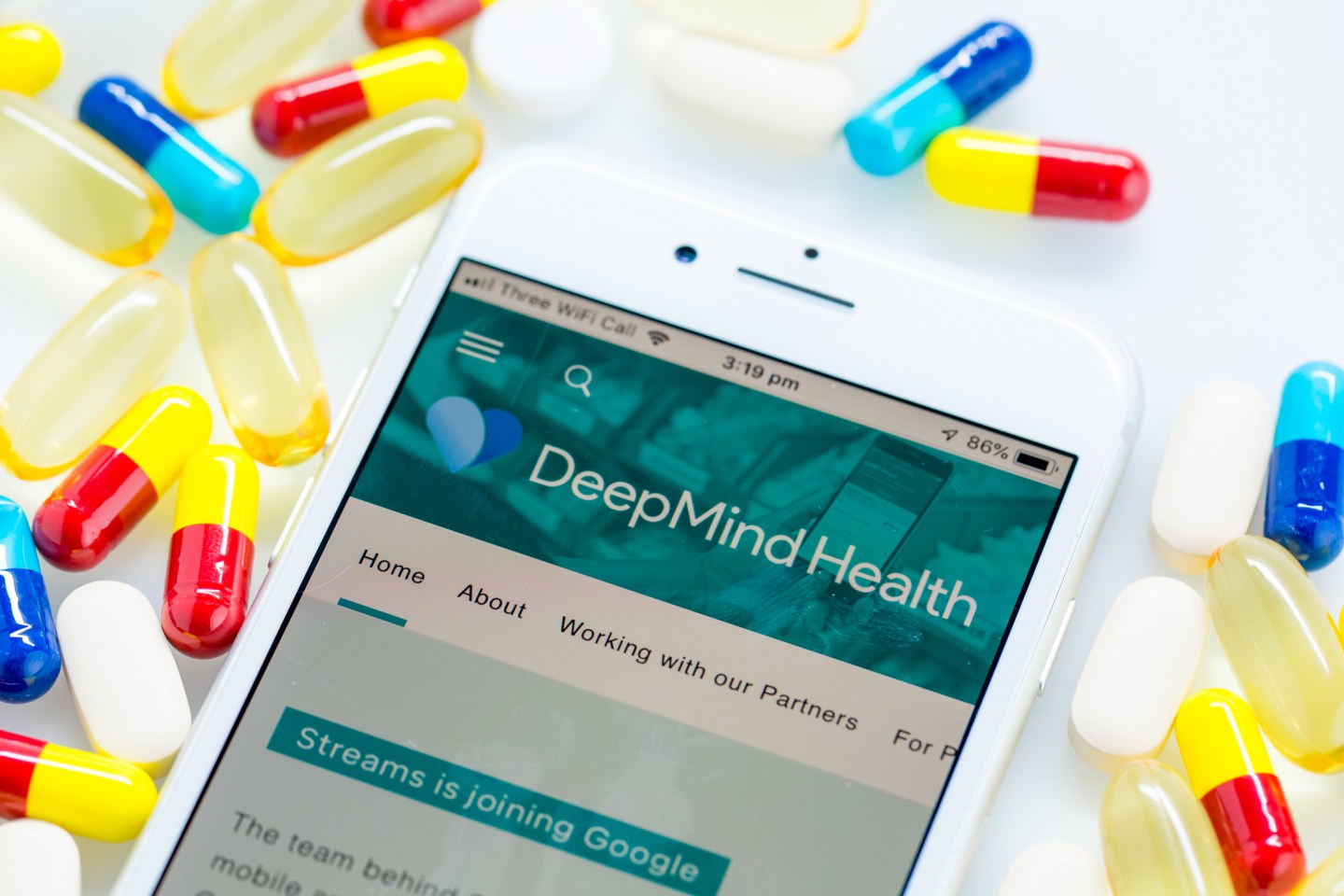 A Deepmind Health webpage sits displayed on the screen of an Apple Inc. iPhone in this arranged photograph in London, U.K. on Monday, Nov. 26, 2018. Three years ago, artificial intelligence company DeepMind Technologies Ltd. embarked on a landmark effort to transform health care in the U.K. Now plans by owner Alphabet Inc. to wrap the partnership into its Google search engine business are tripping alarm bells about privacy.
