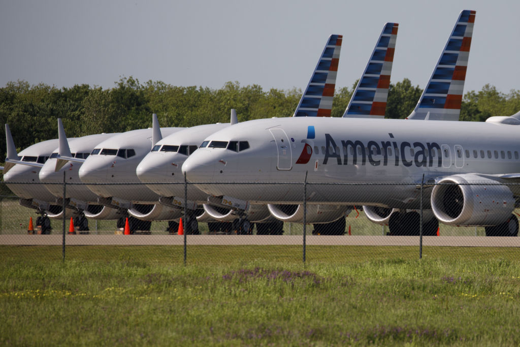 American Airlines Group Inc. Boeing Co. 737 Max planes sit parked outside of a maintenance hangar at Tulsa International Airport (TUL) in Tulsa, Oklahoma, U.S., on Tuesday, May 14, 2019. Three unions representing aviation safety inspectors said in a sharply worded report months before the Boeing's 737 Max was approved for use that the planemaker was given too much authority to oversee itself and that the new jet had safety flaws. Photographer: Patrick T. Fallon/Bloomberg via Getty Images