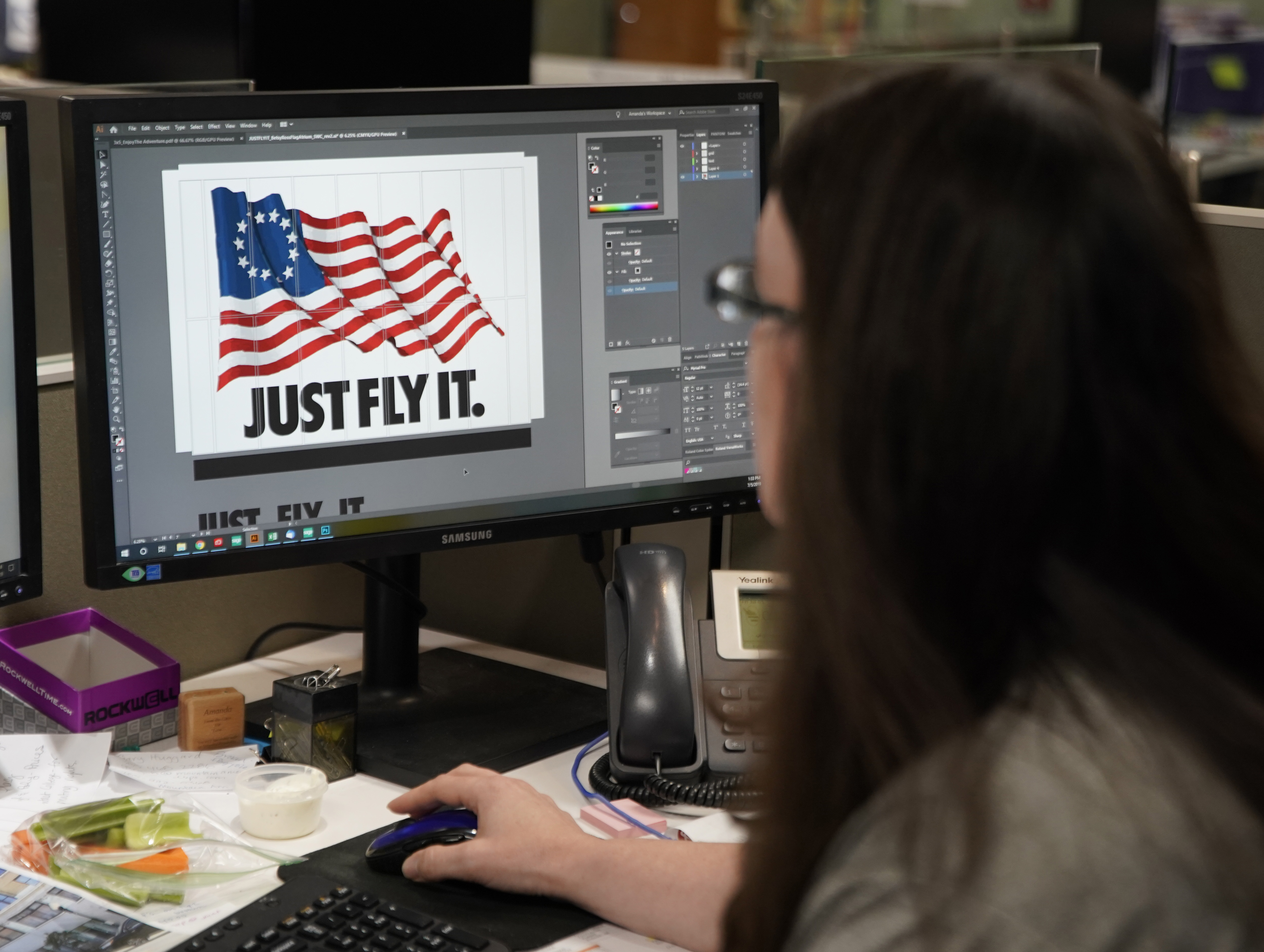 A worker designs a Just Fly It t-shirt with the Betsy Ross flag at Colonial Flag on July 5, 2019 in Salt Lake City, Utah.