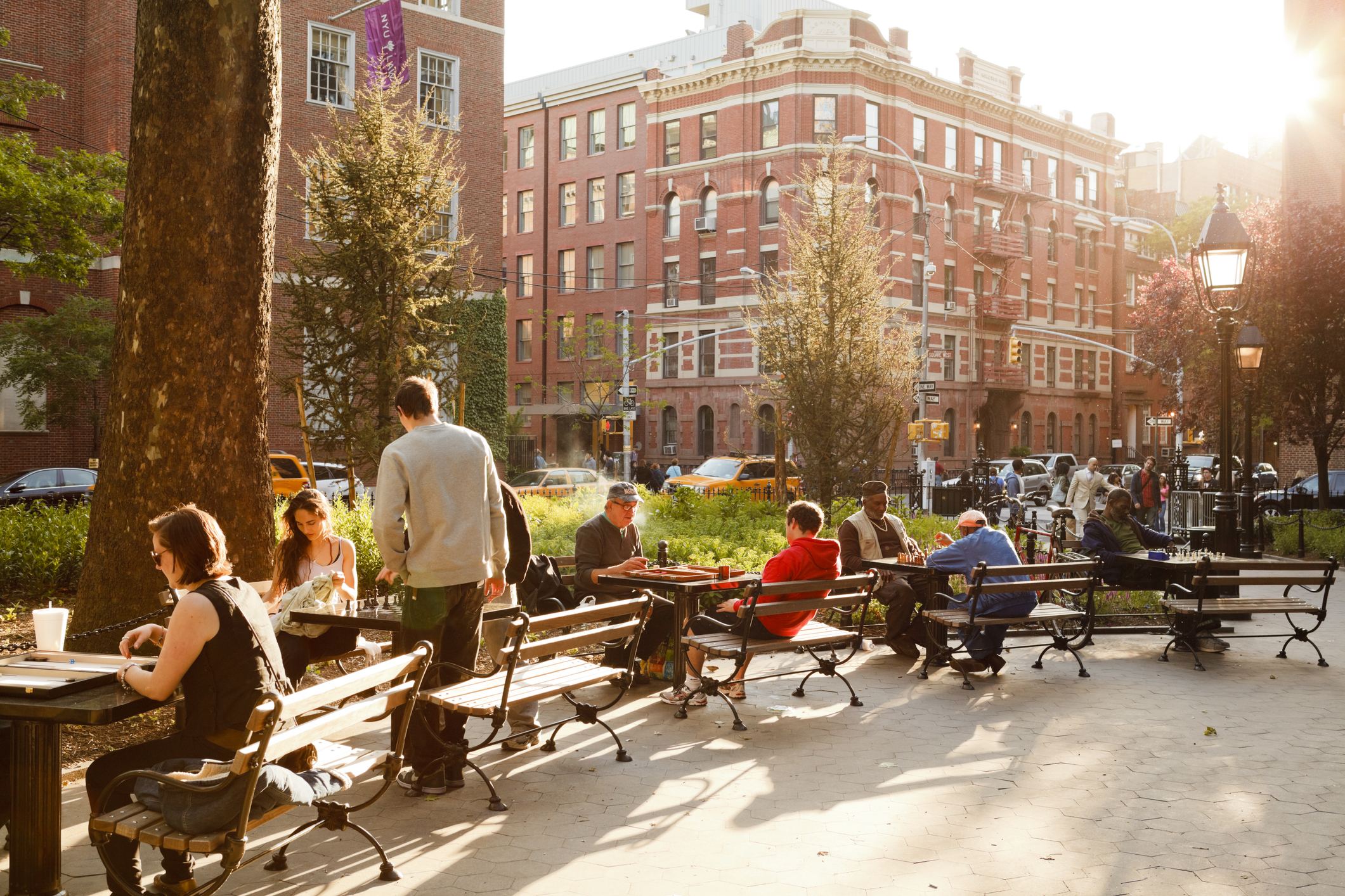 Chess players can be seen in the late afternoon sun in Washington Square Park in Greenwich Village, Manhattan, N.Y.