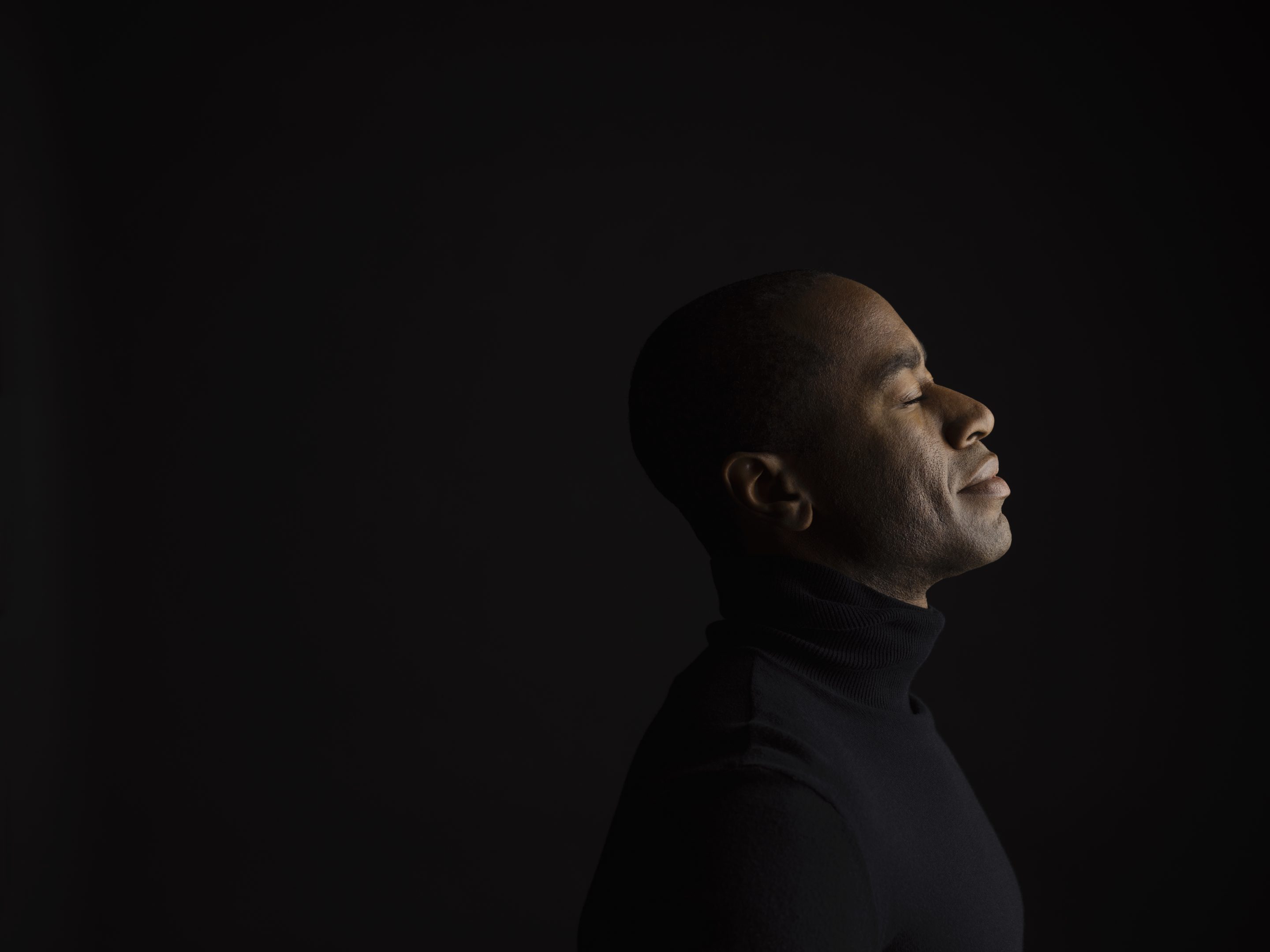 profile of calm man meditating