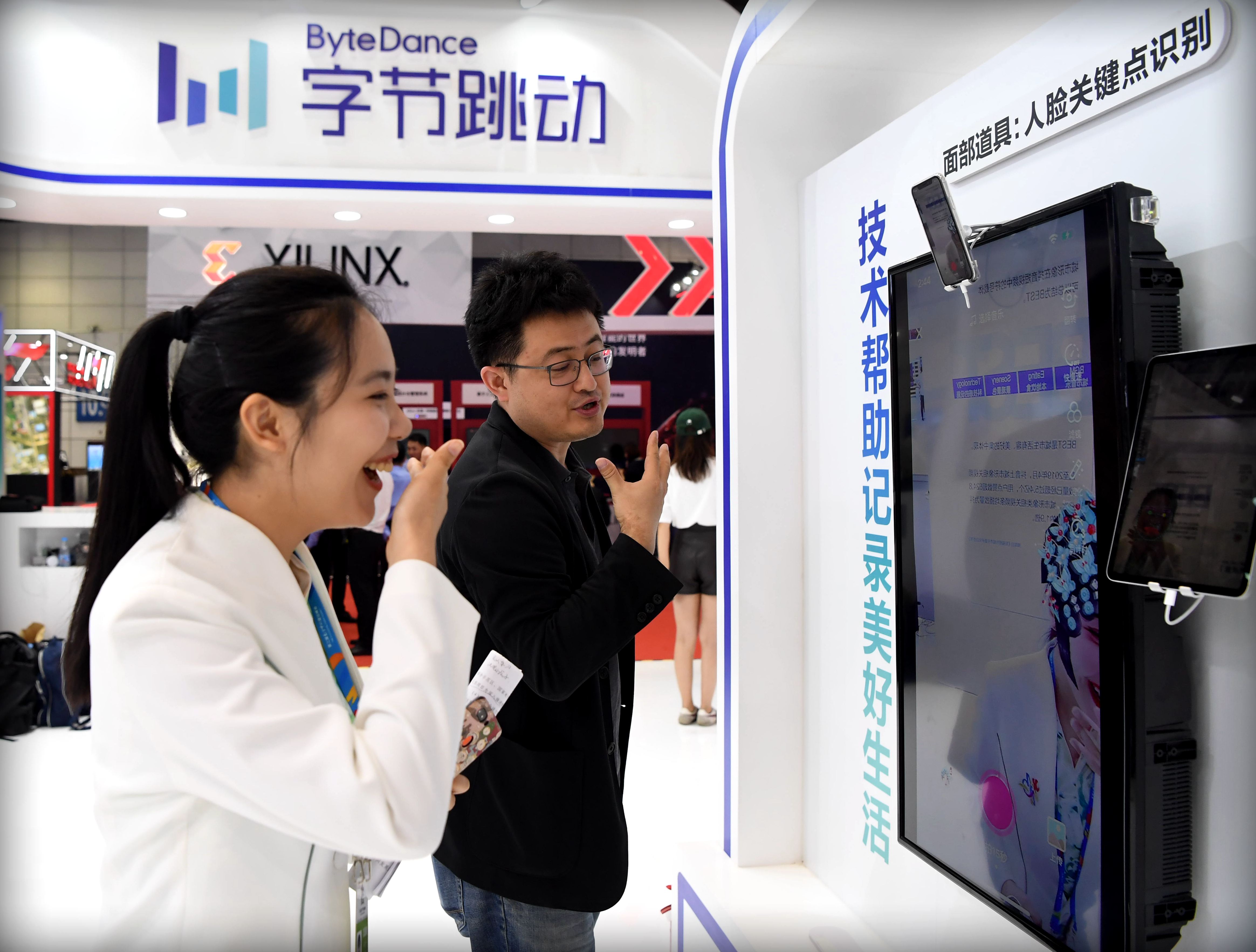 People visit a ByteDance stand