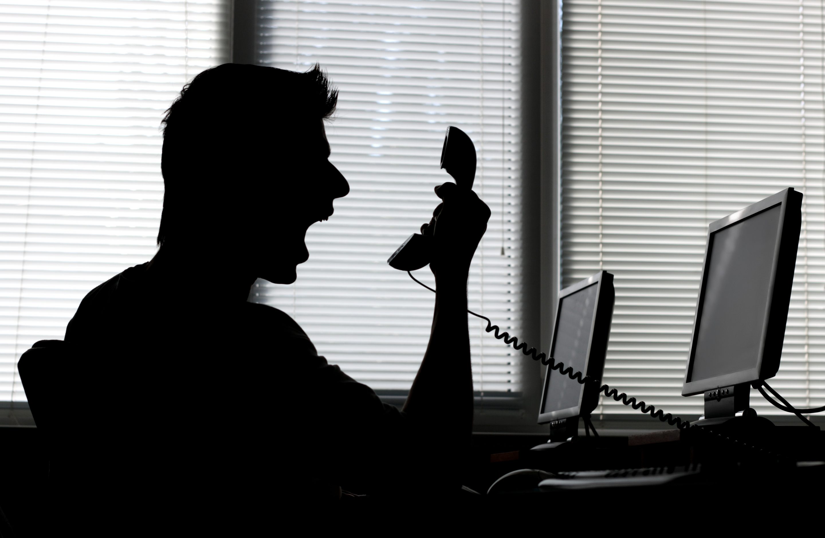 Man yelling into phone