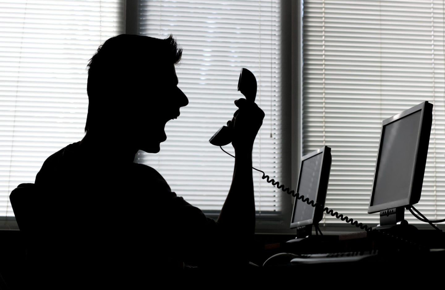 Man yelling into phone