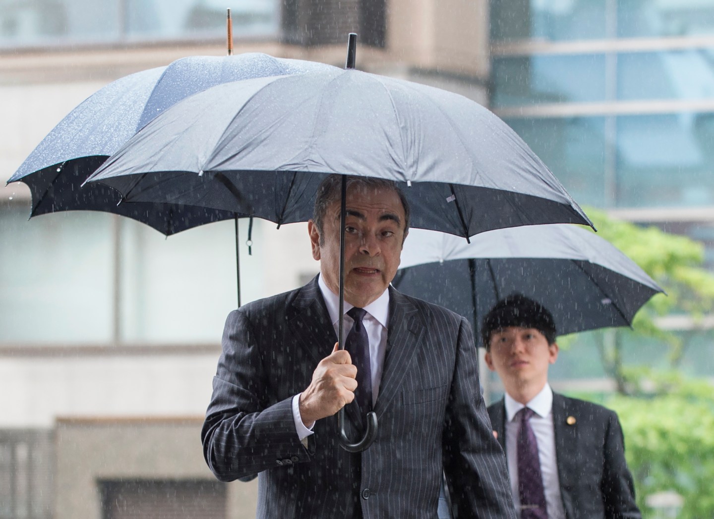TOPSHOT - Former Nissan Motor Chairman Carlos Ghosn arrives for a pre-trial hearing at the Tokyo District Court in Tokyo on June 24, 2019. - The former Nissan chief was bailed for a second time on April 25 and is now preparing for trial on four charges of financial misconduct ranging from concealing part of his salary, to using Nissan funds for personal expenses. (Photo by Kazuhiro NOGI / AFP) (Photo credit should read KAZUHIRO NOGI/AFP/Getty Images)