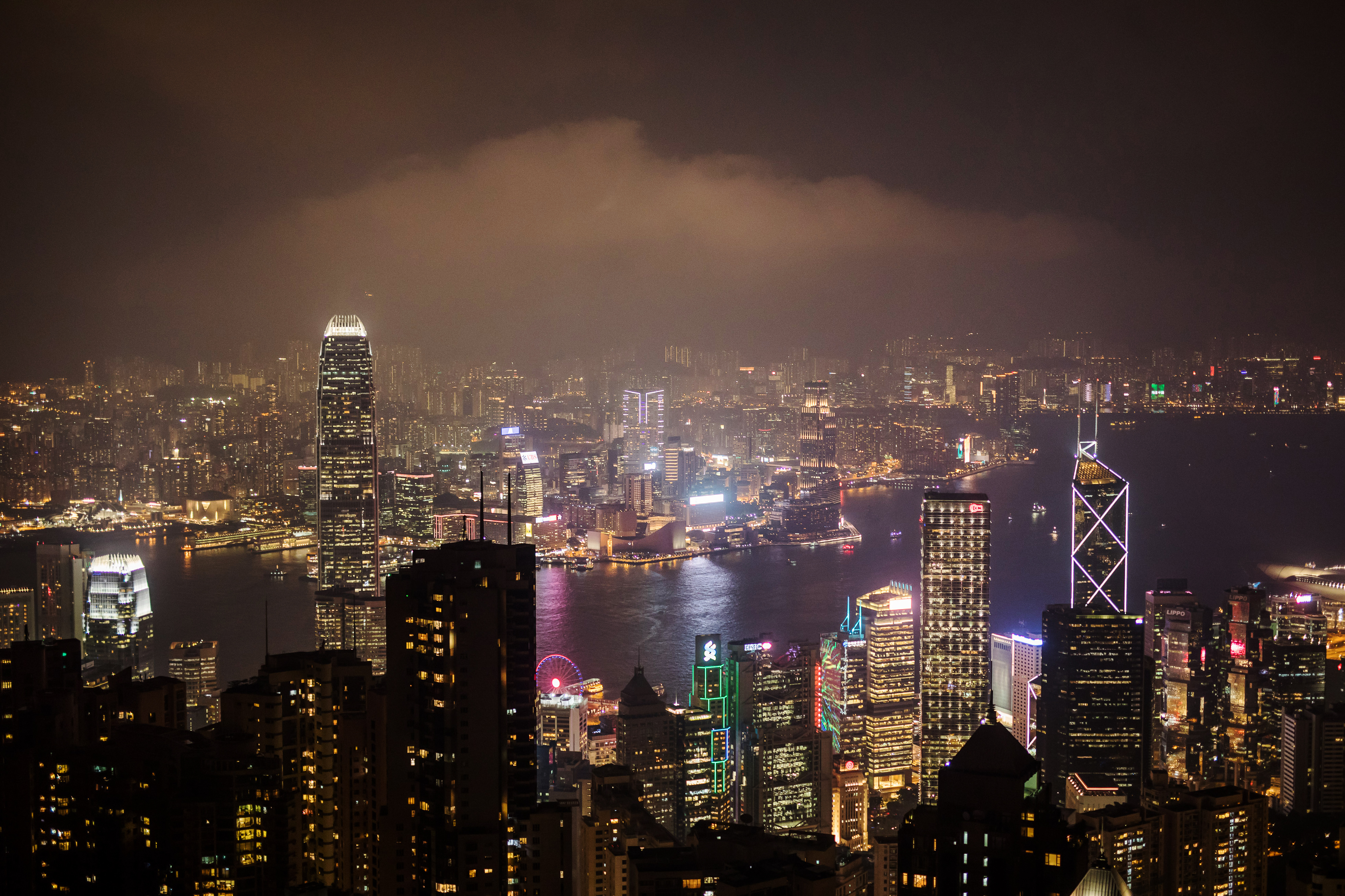Buildings on the Hong Kong skyline are seen from Victoria Peak at night in Hong Kong, China, on Wednesday, Aug. 28, 2019. Anti-government protesters in Hong Kong have sustained their momentum since the first rally on June 9, creating the biggest crisis for Beijings rule over the former British colony since returning to China in 1997. On Monday, Sept. 16, the protests, which show no sign of stopping, will reach the 100-day mark. Photographer: Paul Yeung/Bloomberg via Getty Images