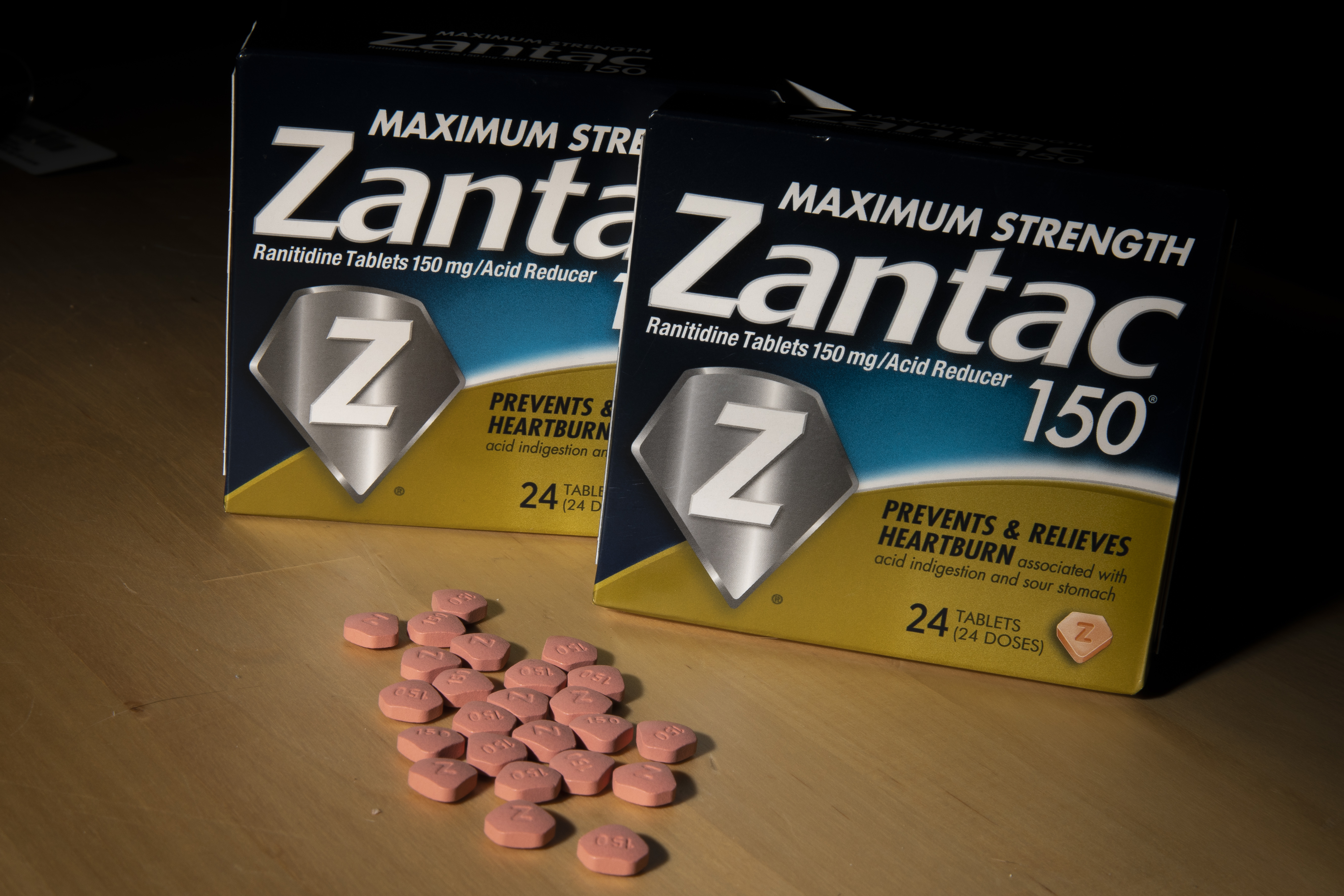 NEW YORK, NY - SEPTEMBER 19: In this photo illustration, packages and pills of Zantac, a popular medication which decreases stomach acid production and prevents heartburn, sit on a table on September 19, 2019 in New York City. The FDA recently announced that is has found small amounts of a probable carcinogen in versions of Zantac and other forms of ranitidine. (Photo Illustration by Drew Angerer/Getty Images)
