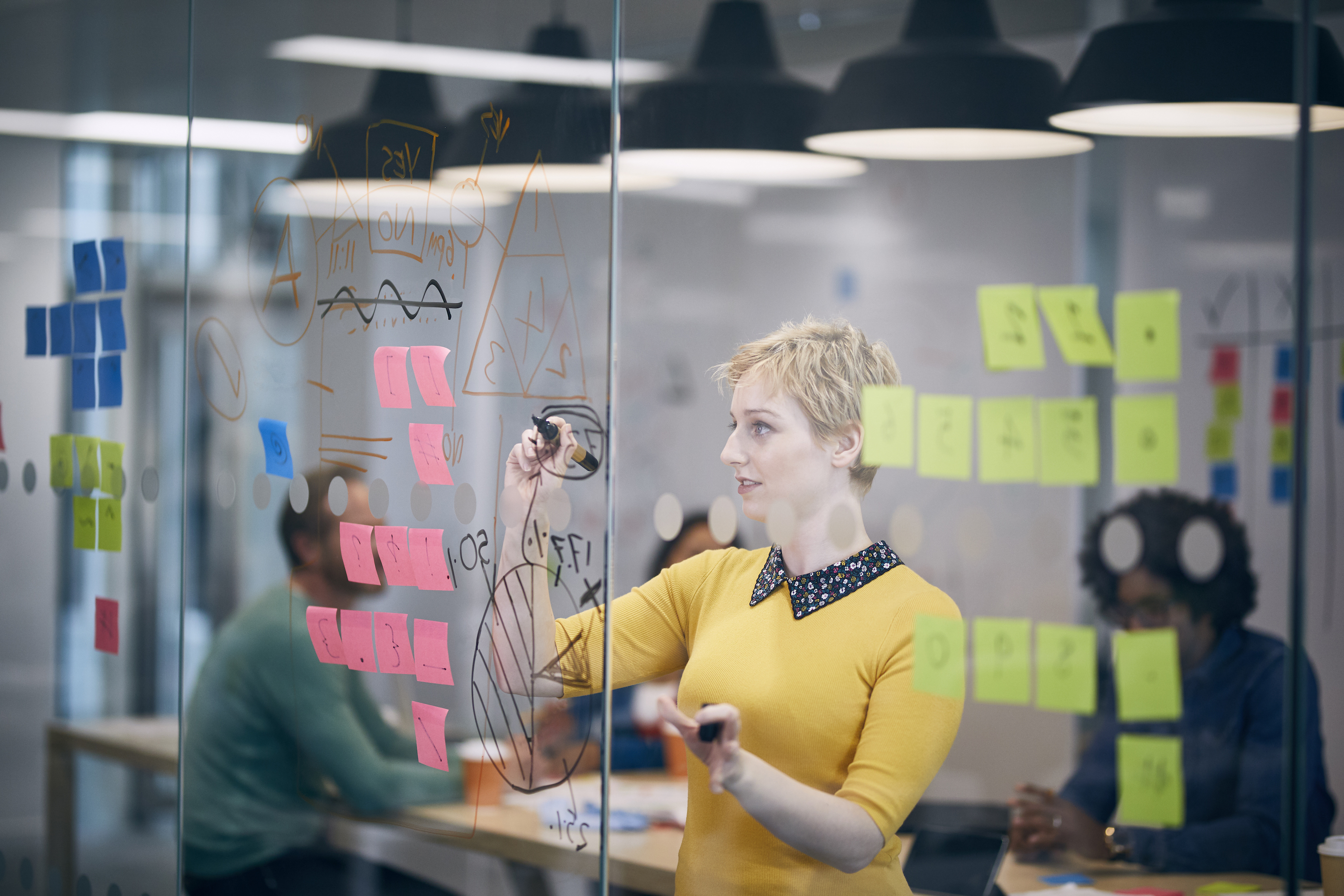 Work colleagues brainstorming in creative office