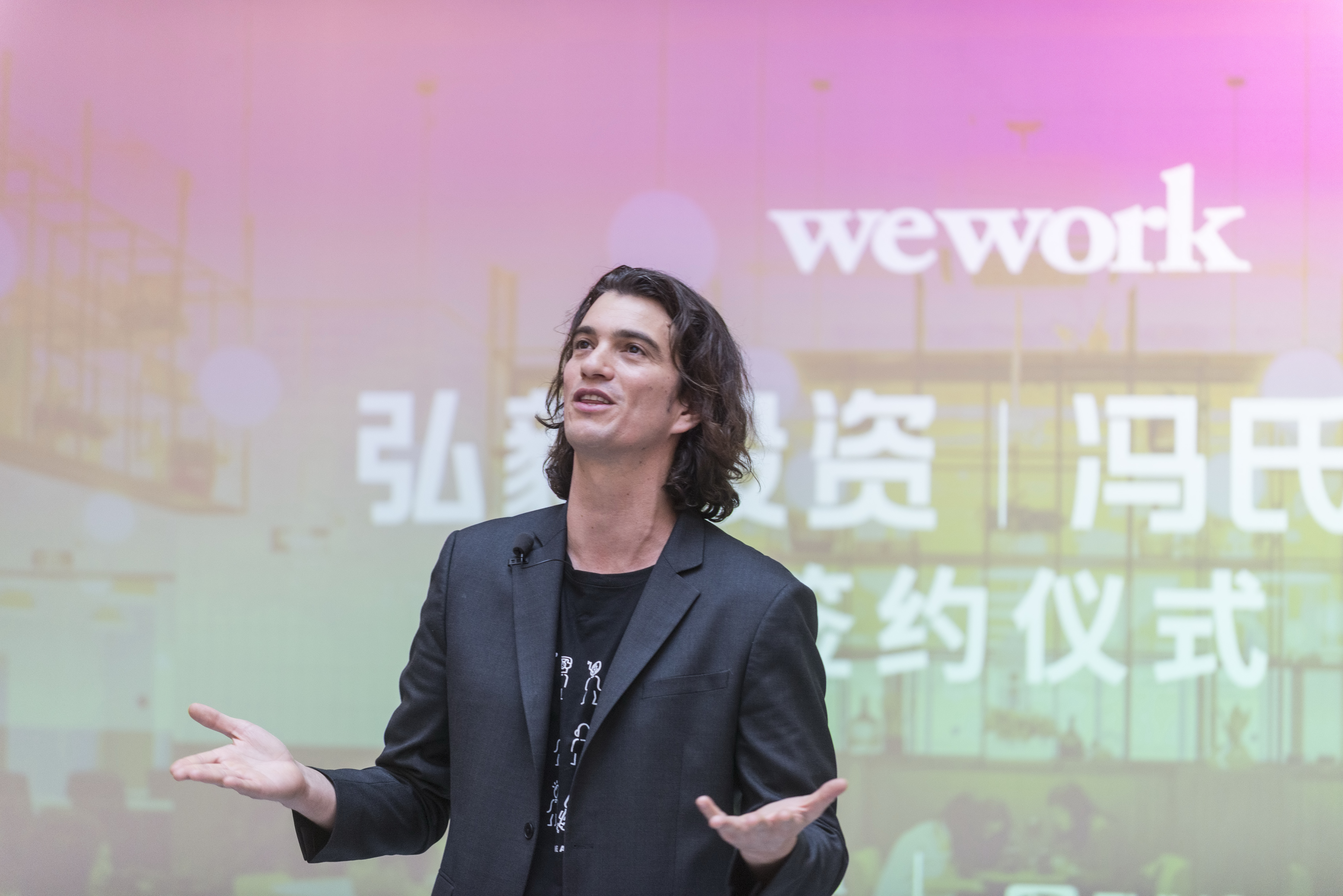SHANGHAI, CHINA - APRIL 12: Adam Neumann, co-founder and chief executive officer of WeWork, speaks during a signing ceremony at WeWork Weihai Road flagship on April 12, 2018 in Shanghai, China. World's leading co-working space company WeWork will acquire China-based rival naked Hub for 400 million U.S. dollars. (Photo by Jackal Pan/Visual China Group via Getty Images)