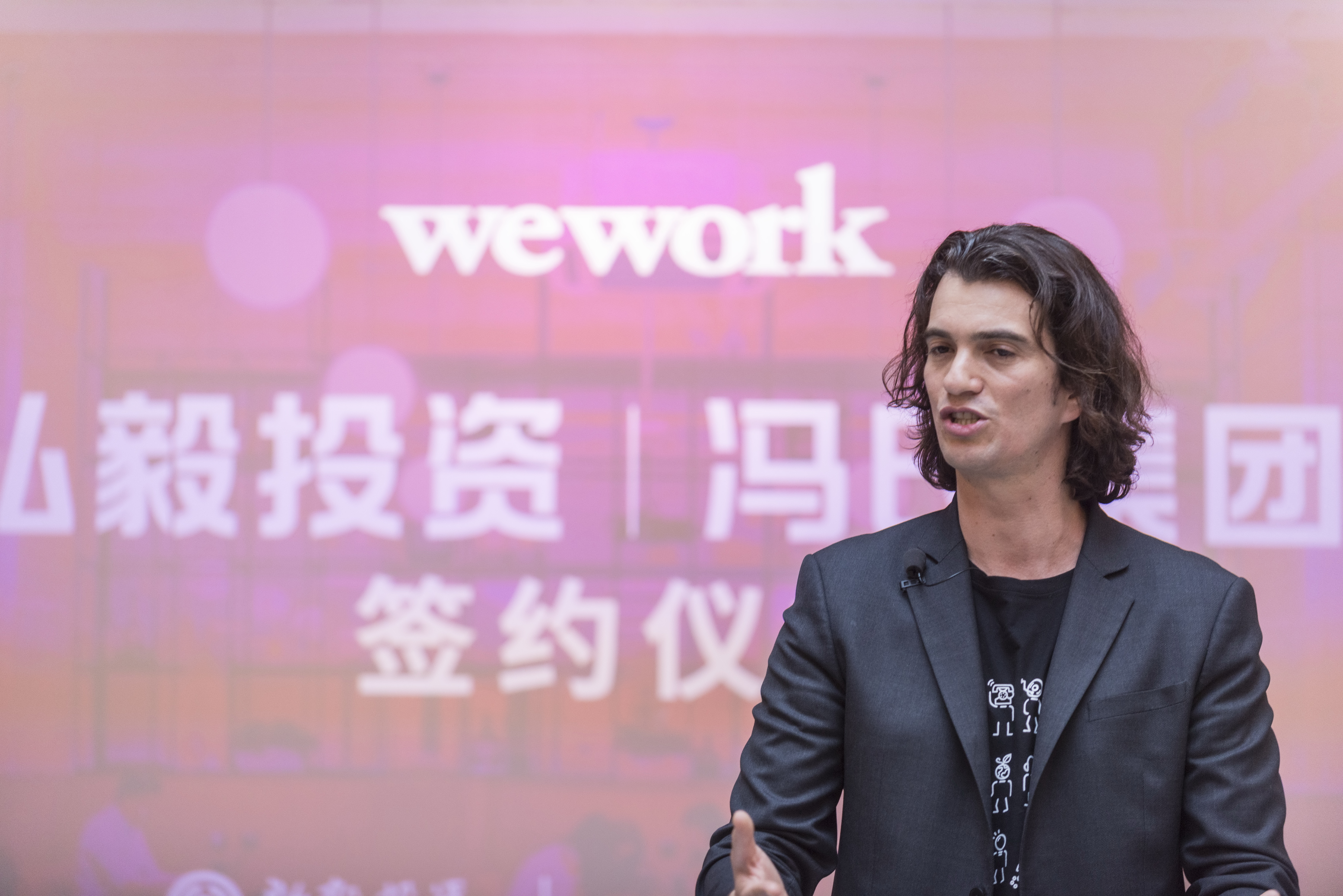 SHANGHAI, CHINA - APRIL 12: Adam Neumann, co-founder and chief executive officer of WeWork, speaks during a signing ceremony at WeWork Weihai Road flagship on April 12, 2018 in Shanghai, China. World's leading co-working space company WeWork will acquire China-based rival naked Hub for 400 million U.S. dollars. (Photo by Jackal Pan/Visual China Group via Getty Images)