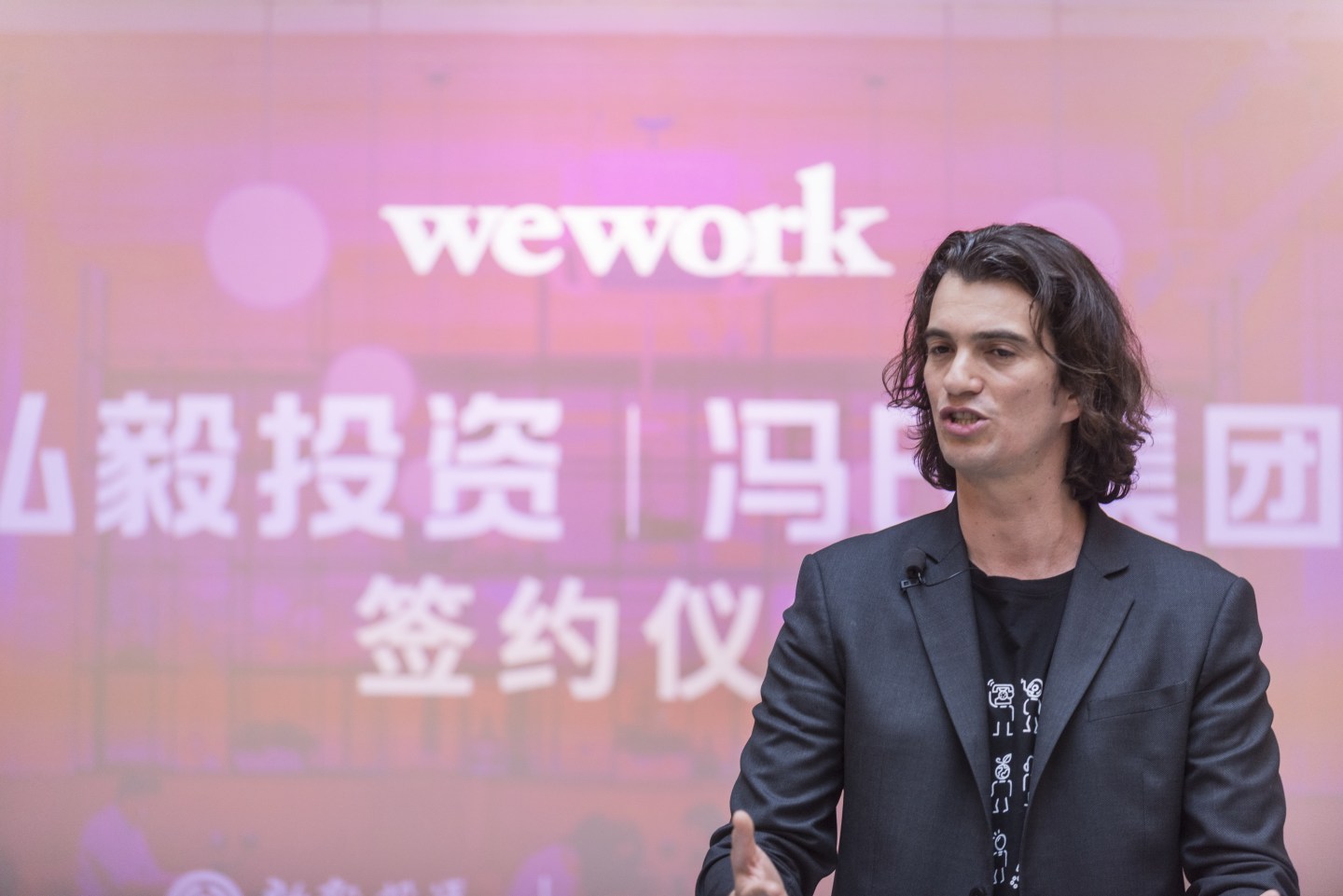 SHANGHAI, CHINA - APRIL 12: Adam Neumann, co-founder and chief executive officer of WeWork, speaks during a signing ceremony at WeWork Weihai Road flagship on April 12, 2018 in Shanghai, China. World's leading co-working space company WeWork will acquire China-based rival naked Hub for 400 million U.S. dollars. (Photo by Jackal Pan/Visual China Group via Getty Images)