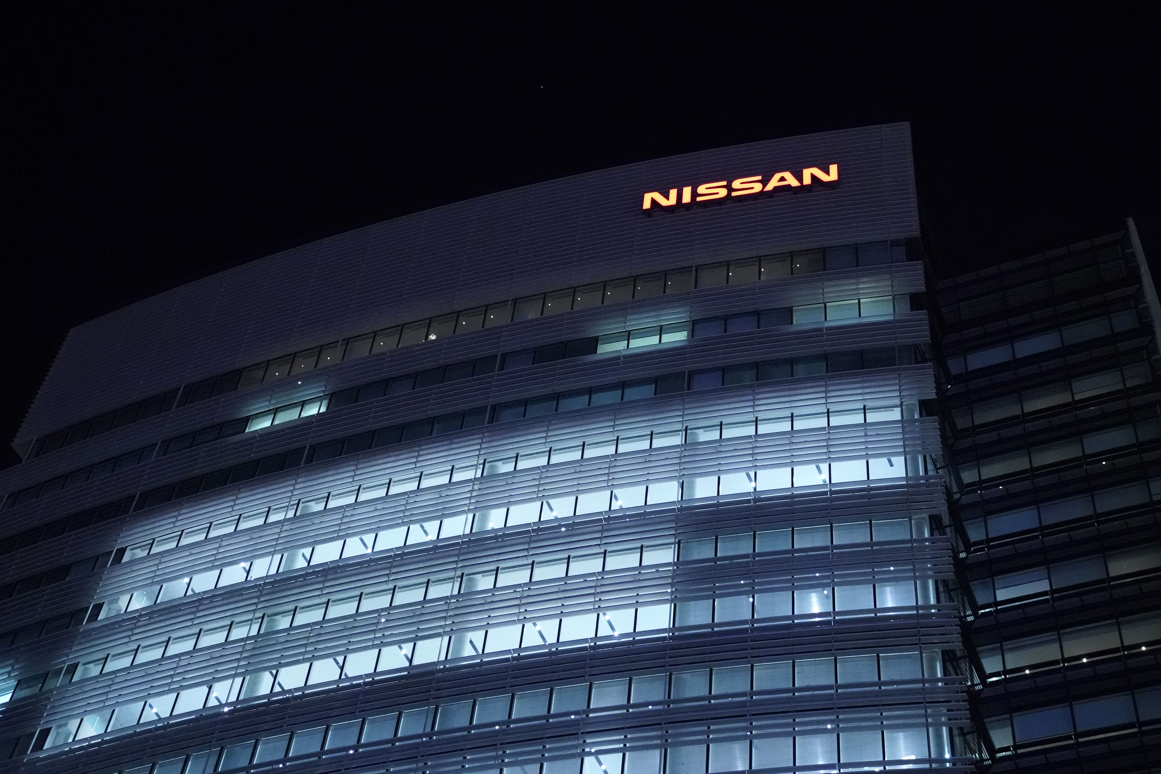Lights illuminate offices at the Nissan Motor Co. in Yokohama, Japan, on Monday, Sept. 9, 2019. Nissan Motor Co. Chief Executive Officer Hiroto Saikawa will step down over a scandal involving inflated stock-linked bonuses, deepening the turmoil thats enveloped the Japanese automaker since the arrest of former Chairman Carlos Ghosn. Photographer: Toru Hanai/Bloomberg via Getty Images