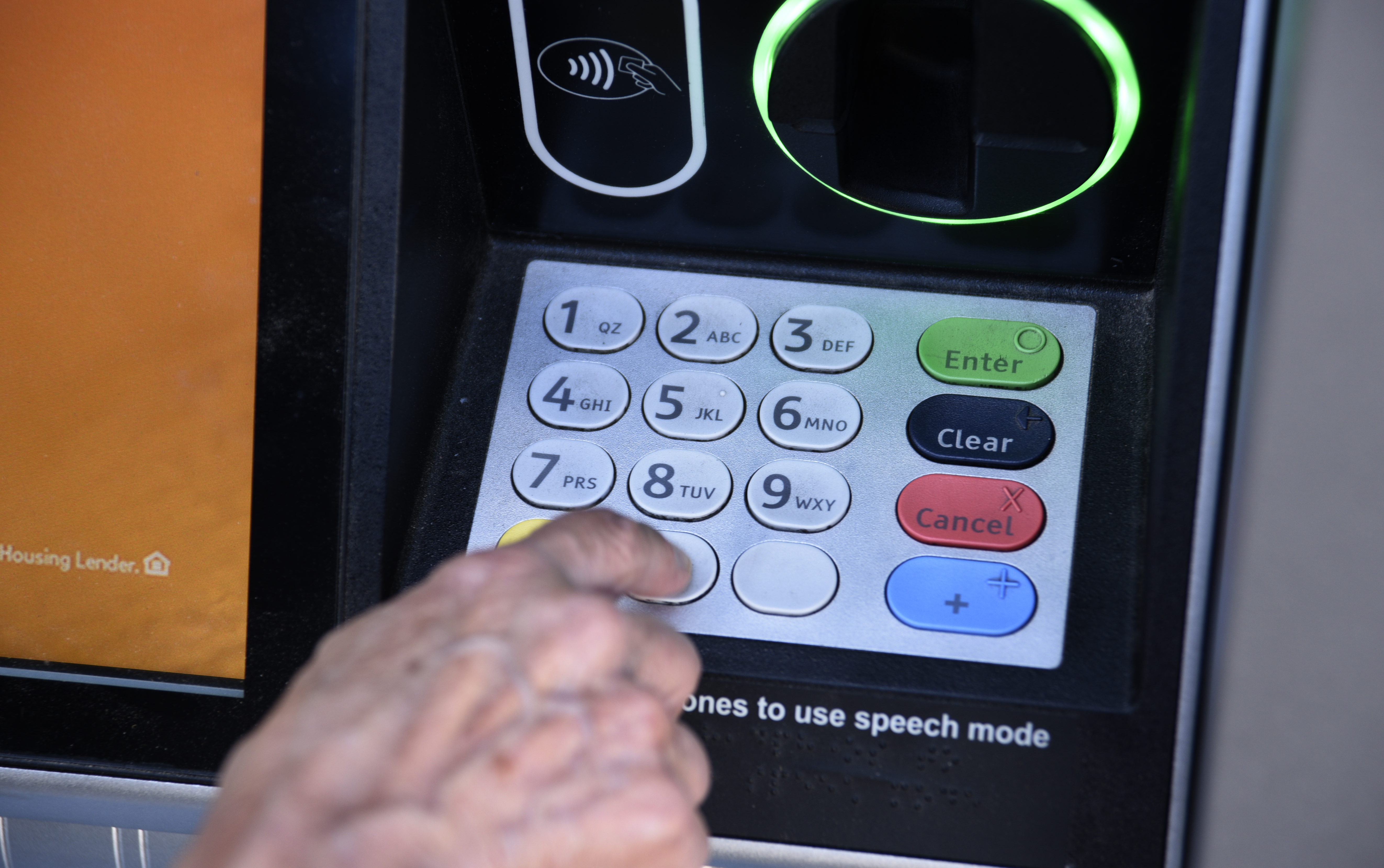 ASHLAND, OREGON - JUNE 17, 2019: A banking customer uses an ATM machine in Ashland, Oregon. (Photo by Robert Alexander/Getty Images)