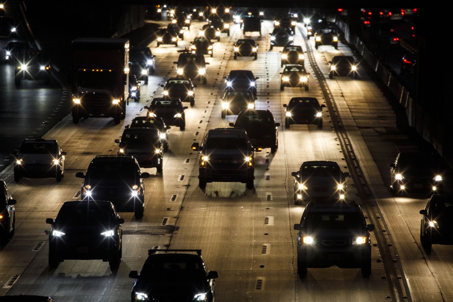 Vehicles drive in traffic down the 405 freeway at night in Inglewood, California, U.S., on Thursday, Sept. 19, 2019. The Trump administration moved to strip California of its authority to limit greenhouse gas emissions from vehicles, even as it warned the state it needs to do more to combat smog. Photographer: Patrick T. Fallon/Bloomberg via Getty Images