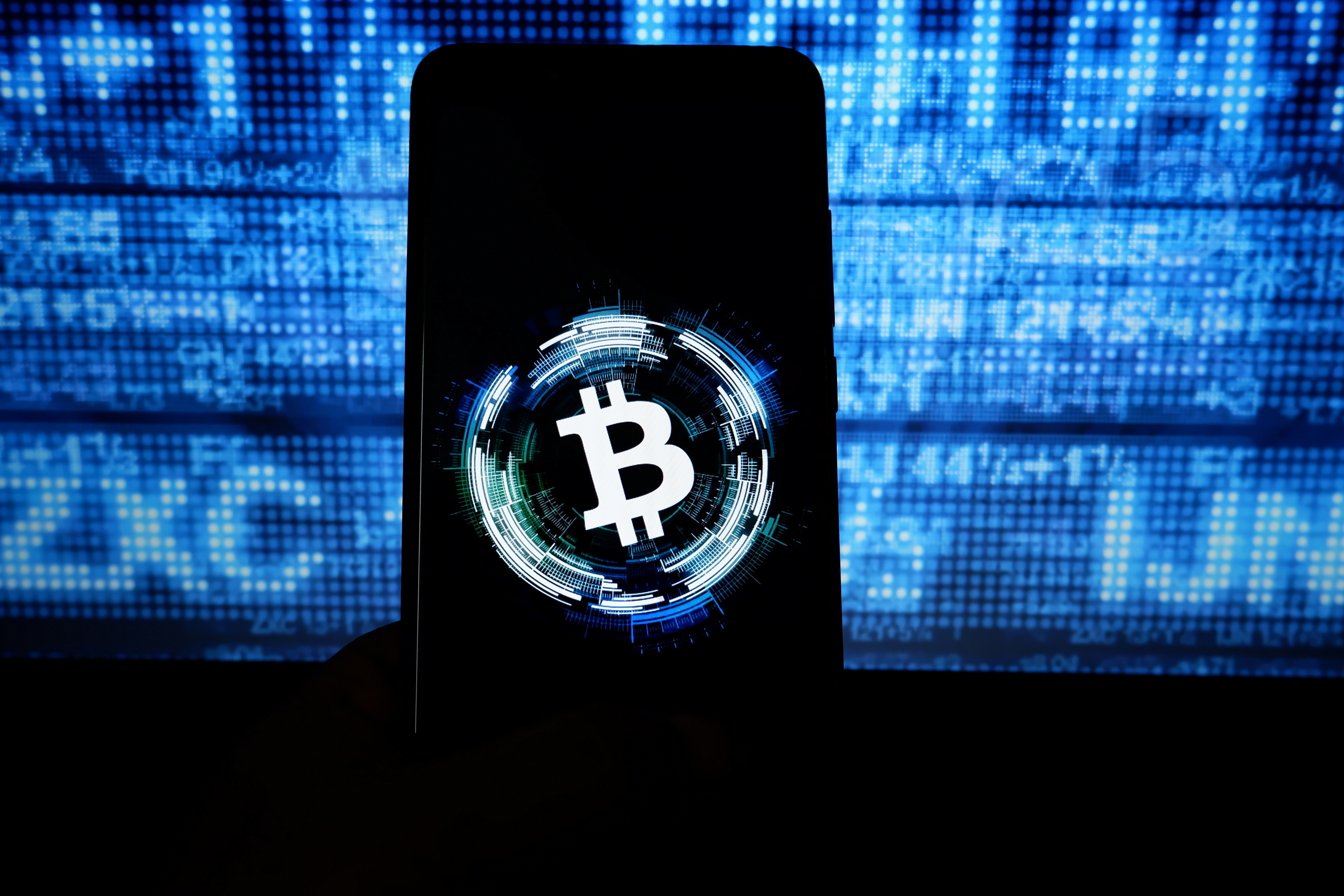 INDIA - 2019/10/09: In this photo illustration a popular cryptocurrency Bitcoin logo seen displayed on a smartphone. (Photo Illustration by Avishek Das/SOPA Images/LightRocket via Getty Images)