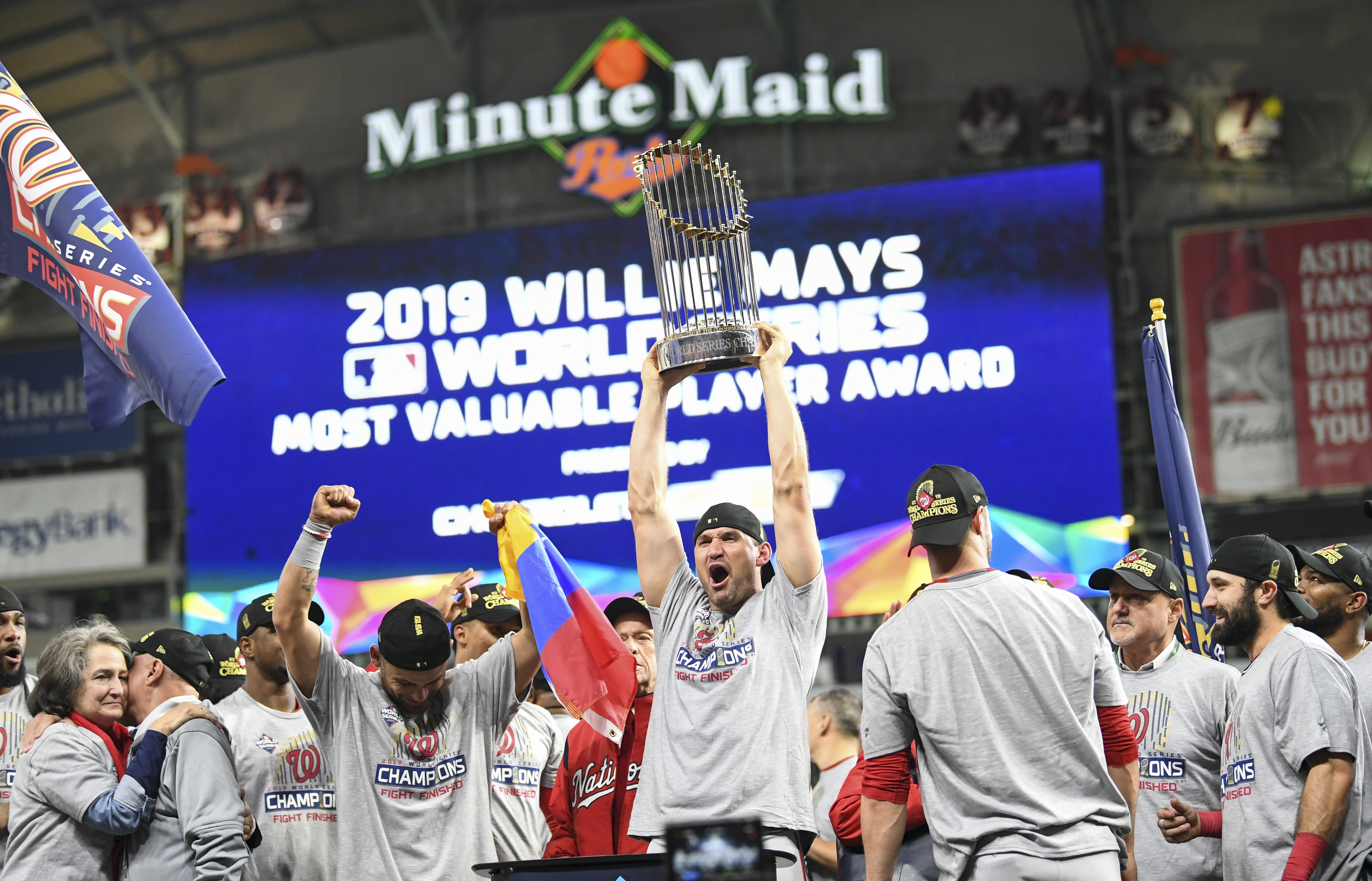 HOUSTON, TEXAS - OCTOBER 30: The Washington Nationals, including Washington Nationals first baseman Ryan Zimmerman (11) holding trophy, celebrate beating the Houston Astros 6-2 in Game 7 of the World Series at Minute Maid Park on Wednesday, October 30, 2019.(Photo by Jonathan Newton/The Washington Post via Getty Images)
