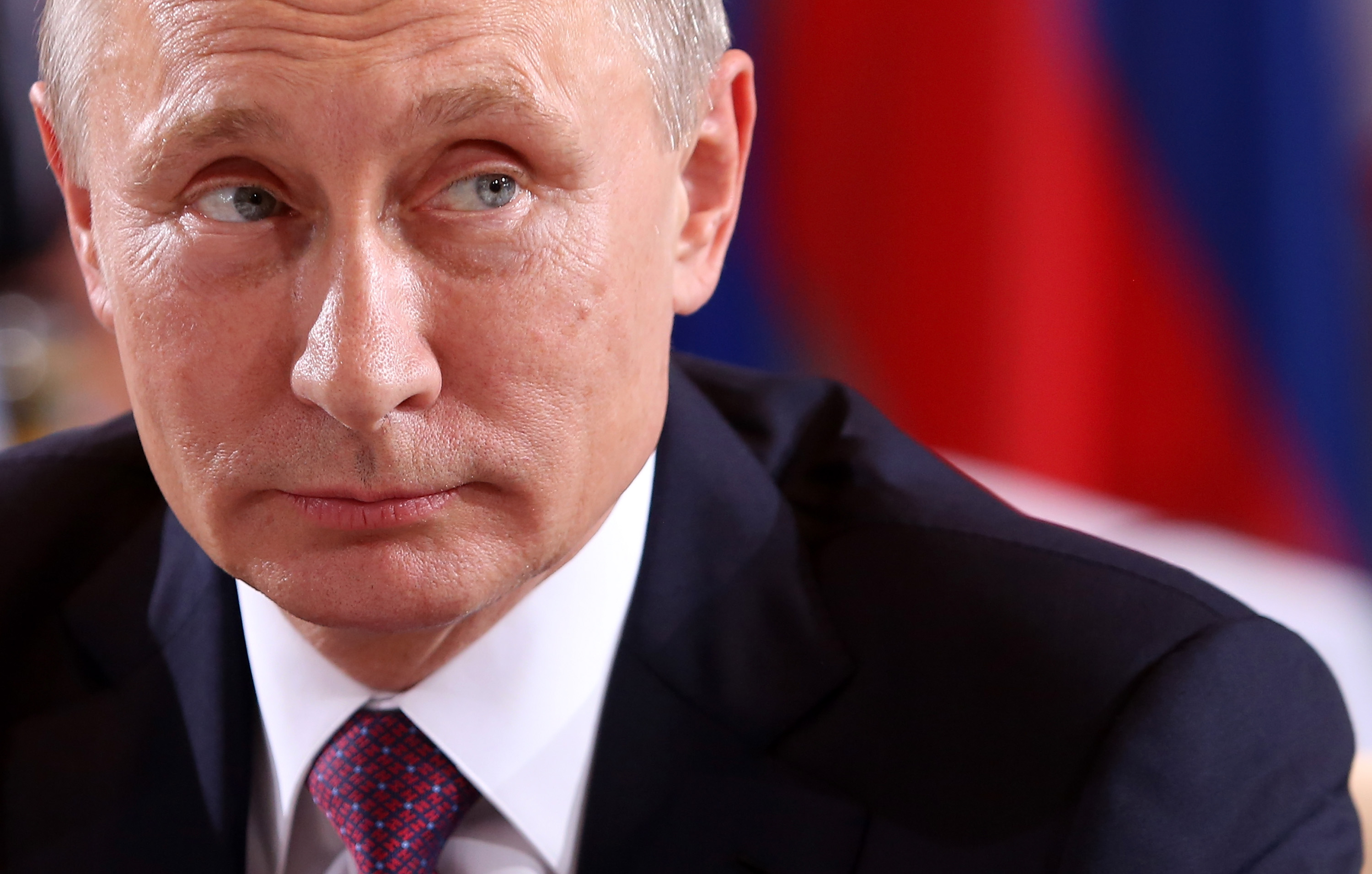 BERLIN, GERMANY - OCTOBER 19:  Russian President Vladimir Putin attends a meeting to discuss the Ukrainian peace process at the German federal Chancellery on October 19, 2016 in Berlin, Germany. The leaders of Russia, Ukraine, France and Germany, known as the Normandy Four, met in Berlin to discuss implementation of the peace plan known as the Minsk Protocol, a roadmap for resolving the conflict in Ukraine after Russian forces invaded in 2014 and annexed the peninsula of Crimea. The United States has threatened renewed sanctions on Russia if the country did not either implement the plan in the coming months or arrive at a plan on how to do so.  (Photo by Adam Berry/Getty Images)