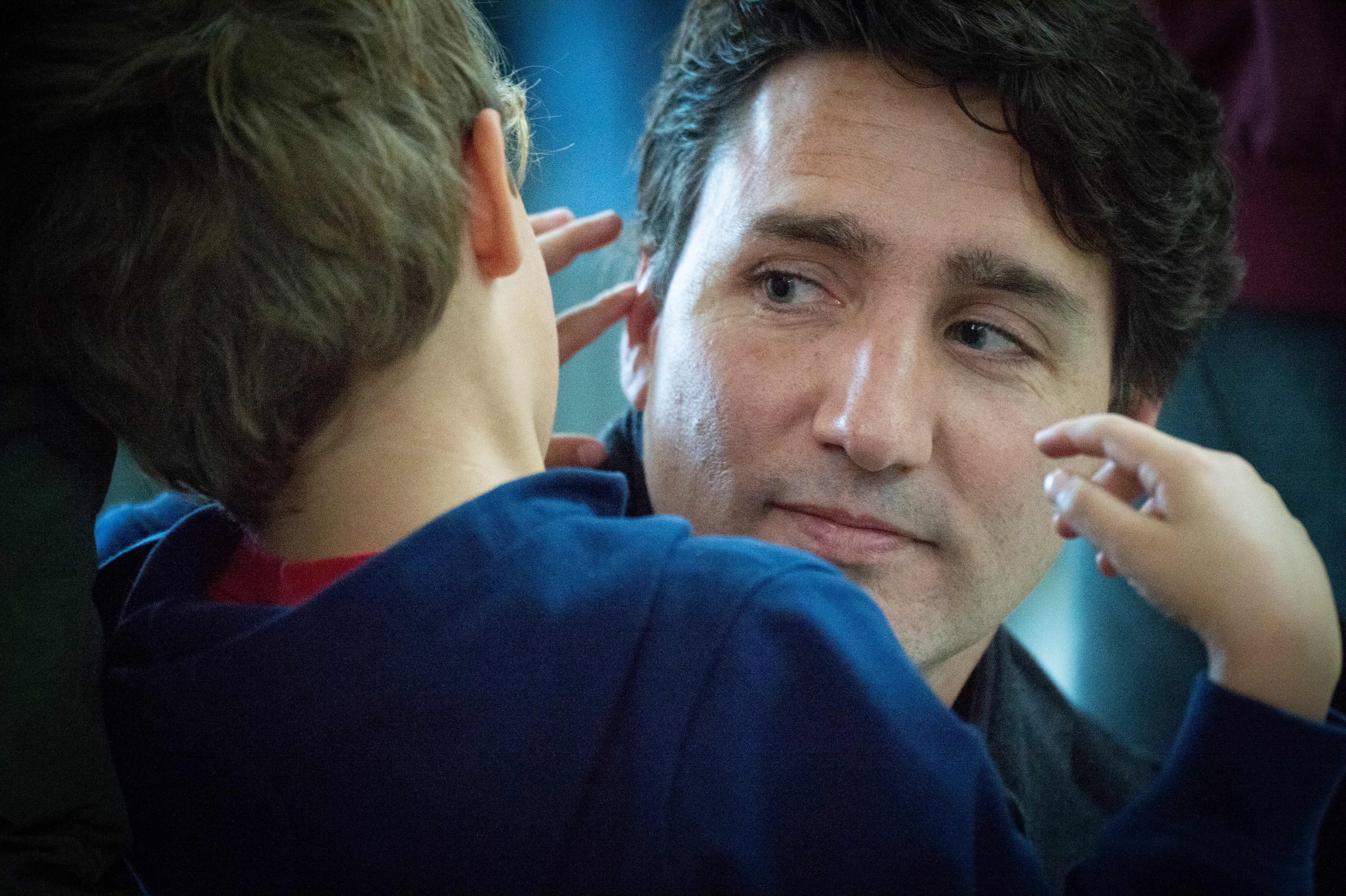 Leader of the Liberal Party of Canada, Justin Trudeau votes with his family in Montreal, Quebec on October 21, 2019. - Canadians began voting in a general election Monday, with surveys predicting a minority government as Prime Minister Justin Trudeau's Liberal Party risks losing its majority or even being kicked out of office.The Liberals and the Conservatives, led by Andrew Scheer, could be set for a near dead heat with pundits calling it one Canada's closest elections ever.