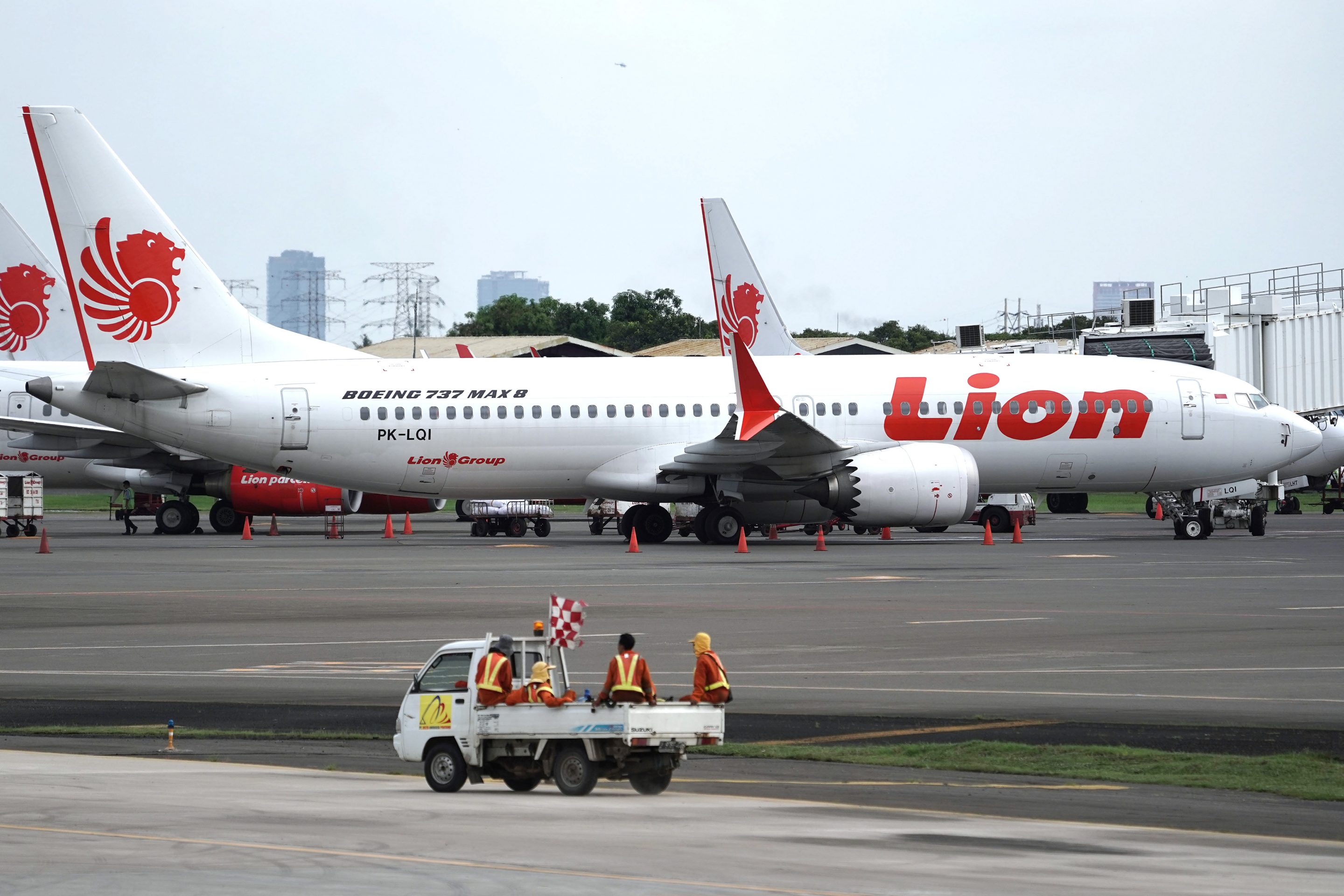 A Lion Air Boeing Co. 737 Max 8 aircraft stands on the tarmac at Soekarno-Hatta International Airport in Cenkareng, Indonesia, on Tuesday, March 12, 2019. Indonesias Lion Air, one of the biggest customers of Boeings 737 Max plane, is suspending delivery of four of the jets it had on order for this year after the second fatal accident involving the model in five months. Photographer: Dimas Ardian/Bloomberg via Getty Images