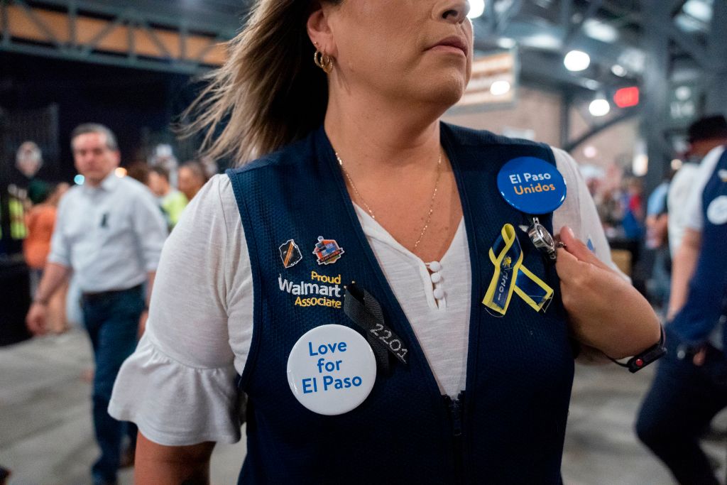 A Walmart employee attends a community memorial service for the 22 victims of the mass shooting at Southwest University Park in El Paso, Texas on August 14, 2019. Paul Ratje—AFP via Getty Images