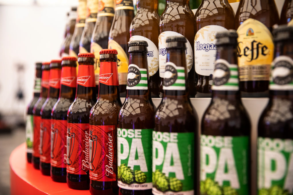 Budweiser beer products, produced by Anheuser-Busch InBev NV, sit on display during the company's listing ceremony at the Hong Kong Stock Exchange in Hong Kong, China, on Monday, Sept. 30, 2019.
