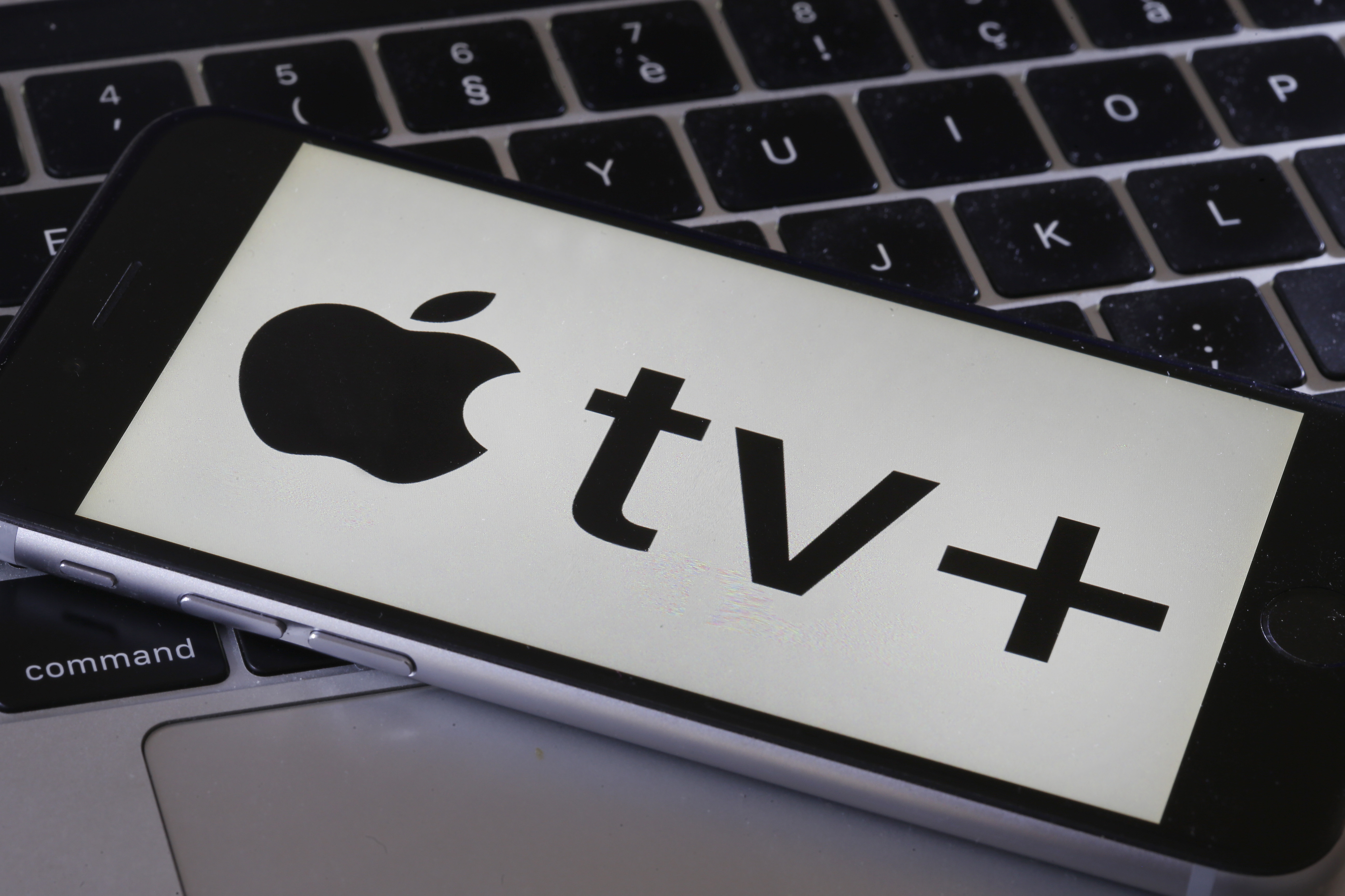 PARIS, FRANCE - SEPTEMBER 11: In this photo illustration, the Apple TV Plus logo is displayed on an iPhone screen on September 11, 2019 in Paris, France. Yesterday, the US multinational Apple announced at its keynote launch its video on demand web television entitled Apple TV Plus. video streaming service Apple TV + will be available from November 1, 2019 in France and in a hundred countries at a rate of 4.99 euros per month.