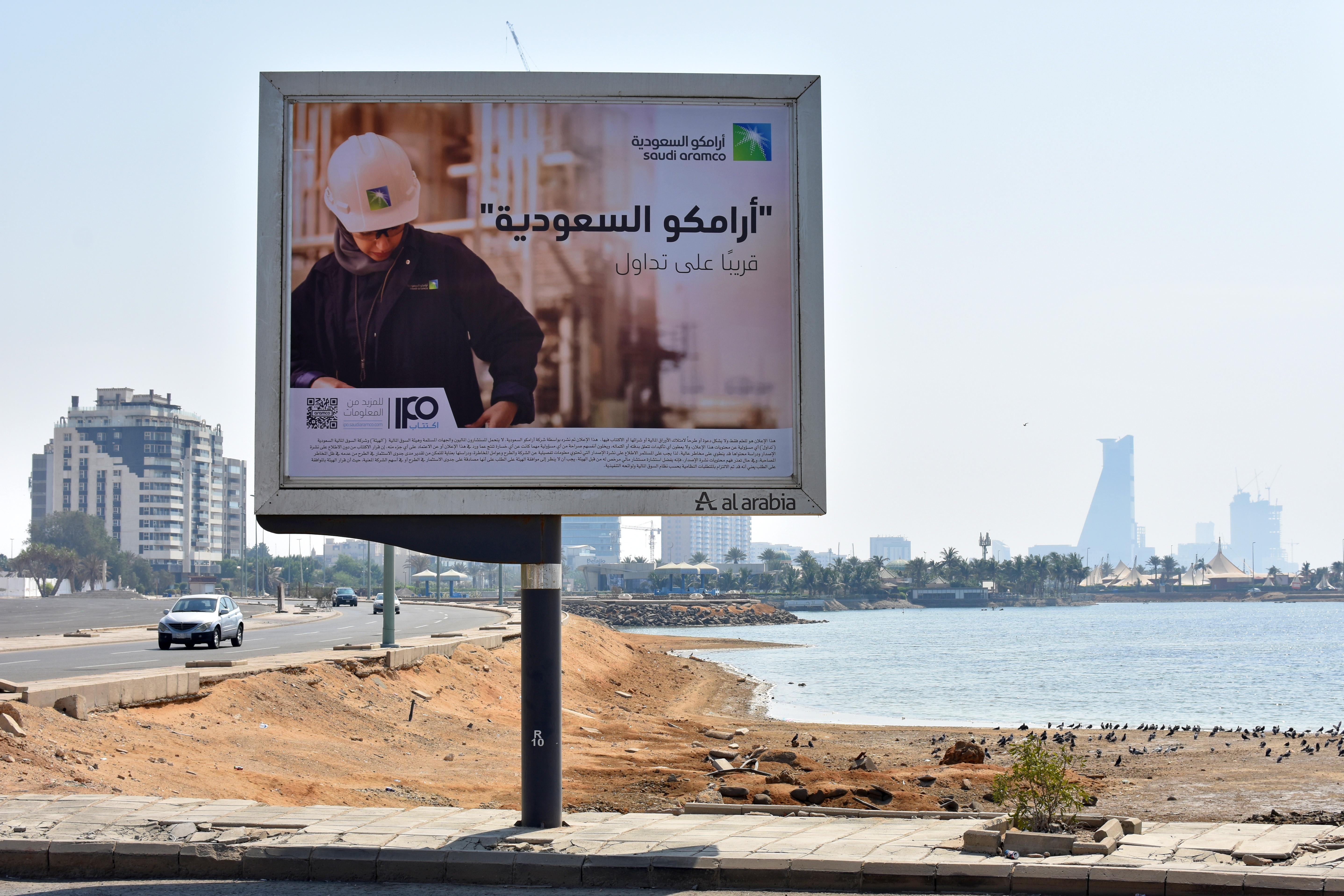 An advertisement advertising the planned Saudi Aramco initial public offering (IPO) sits on display at the Corniche coastline in Jeddah, Saudi Arabia, on Friday, Nov. 8, 2019. Saudi Arabias Crown Prince Mohammed Bin Salman may have lowered his valuation-target for Saudi Aramco as it prepares an initial public offering, but some of the worlds biggest investors say hes not gone far enough. Photographer: Rodney Jefferson/Bloomberg via Getty Images