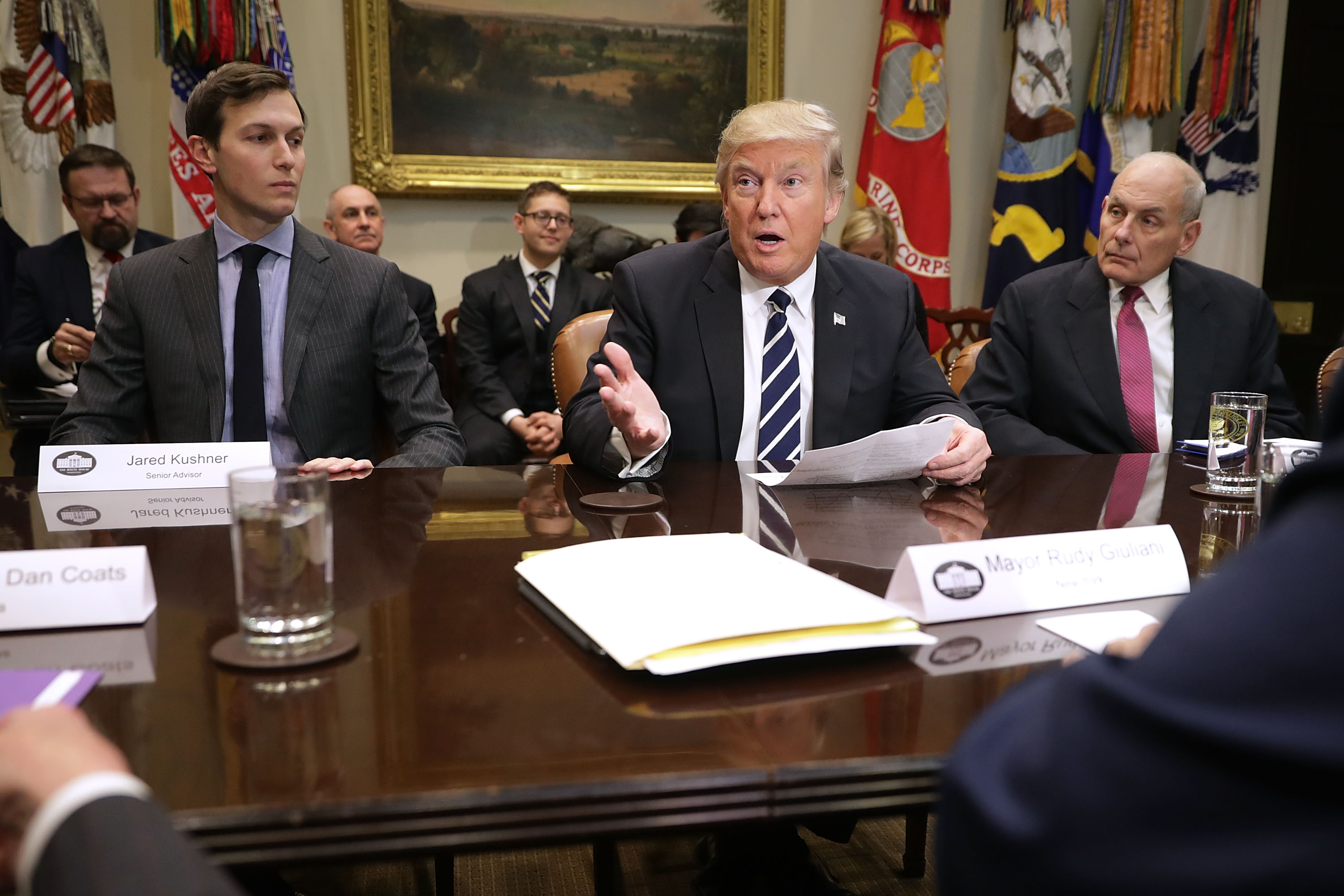 WASHINGTON, DC - JANUARY 31: U.S. President Donald Trump (C) delivers remarks at the beginning of a meeting with his son-in-law and Senior Advisor Jared Kushner (L), Homeland Security Secretary John Kelly and other government cyber security experts in the Roosevelt Room at the White House January 31, 2017 in Washington, DC. Citing the hack of computers at the Democratic National Committee by Russia, Trump said that the private and public sectors must do more to prevent and protect against cyber attacks. (Photo by Chip Somodevilla/Getty Images)