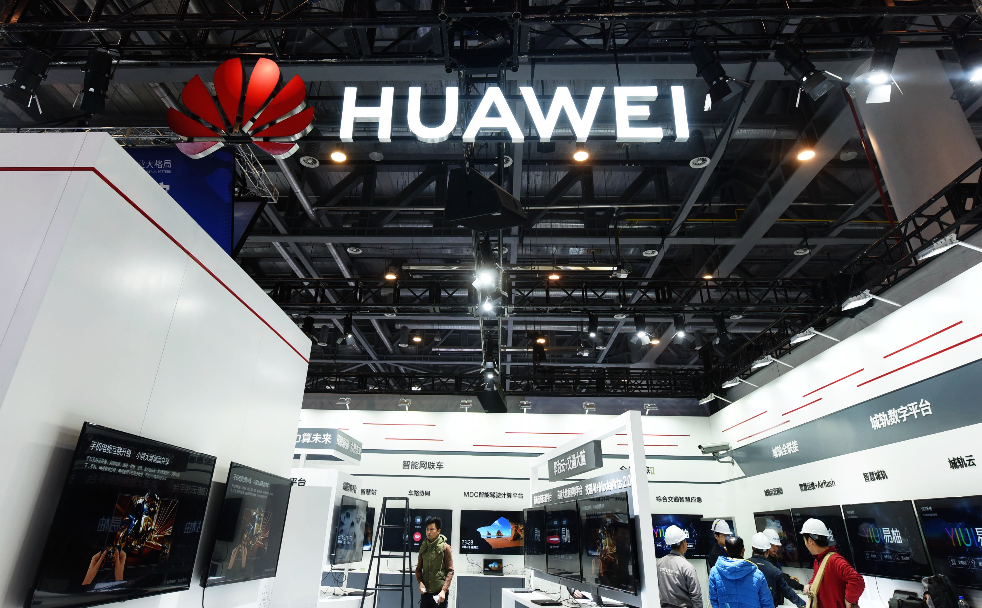 HANGZHOU, CHINA - DECEMBER 05: Workers set up the Huawei booth before the 2nd Zhejiang International Intelligent Transportation Industry Expo on December 5, 2019 in Hangzhou, Zhejiang Province of China. The expo will be held in Hangzhou from December 6 to 8. (Photo by Long Wei/VCG via Getty Images)