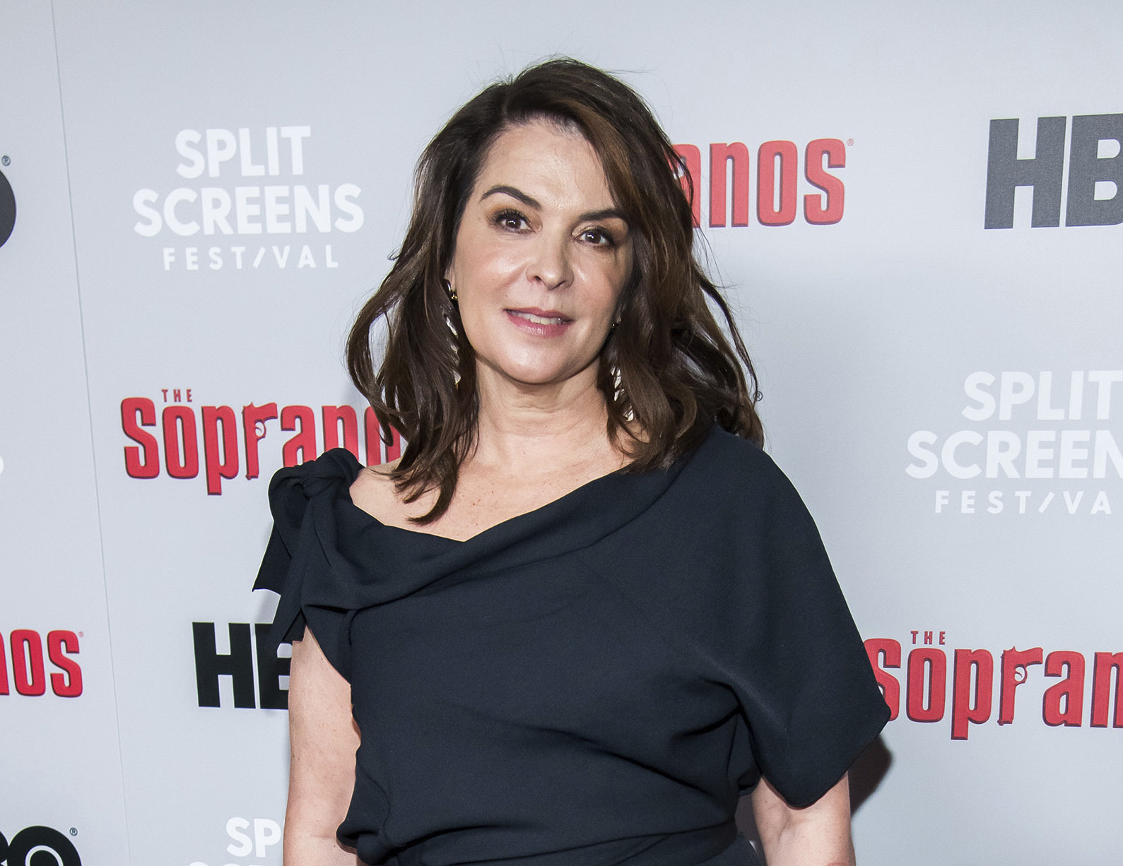 FILE - In this Jan. 9, 2019, file photo, Annabella Sciorra attends HBO's "The Sopranos" 20th anniversary at the SVA Theatre in New York. Sciorra is set to confront Harvey Weinstein at his New York City rape trial, more than a quarter-century after she says he pinned her to a bed and raped her. She is expected to testify Thursday, Jan. 23, 2020. (Photo by Charles Sykes/Invision/AP, File)